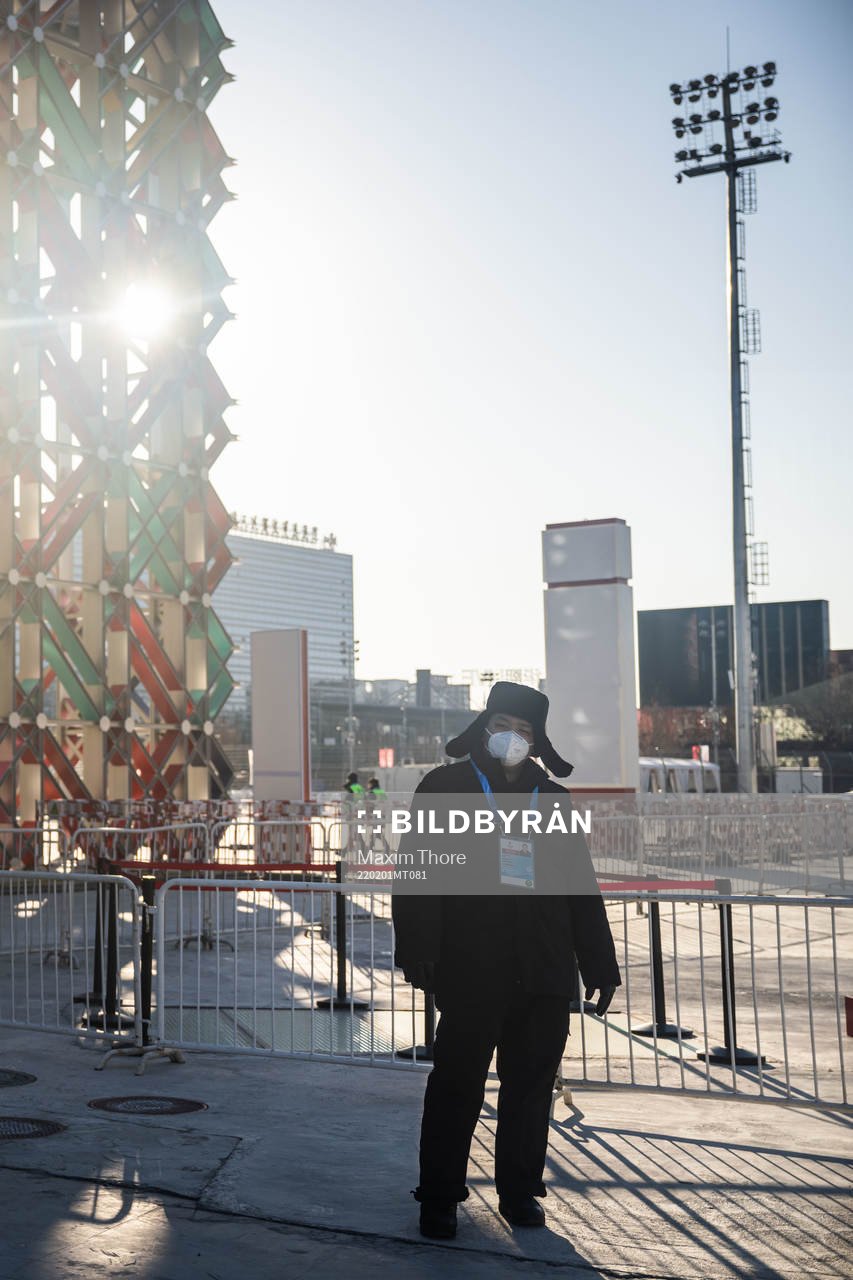A man with a protective mask outside the practice venue of
