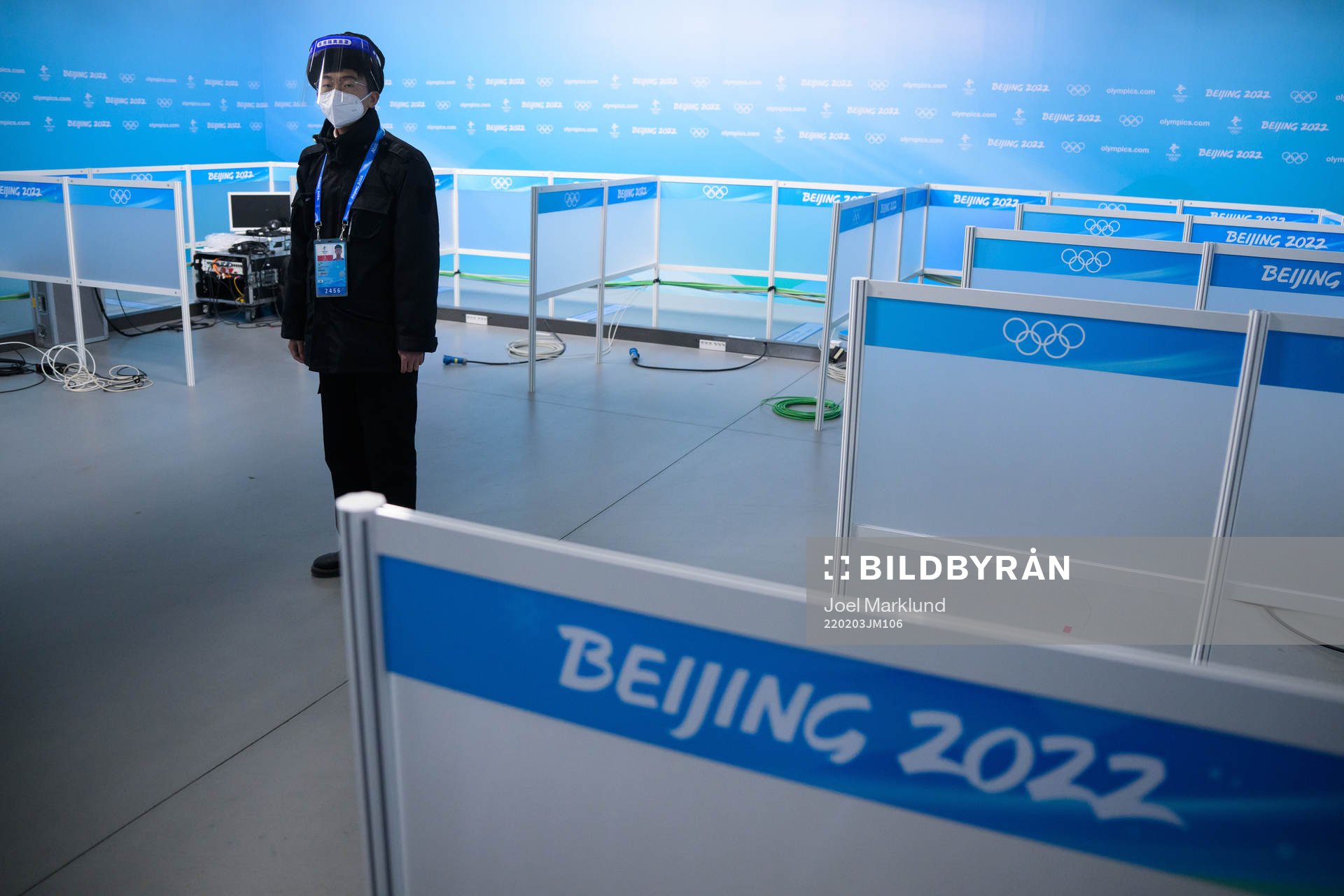 A man with personal protective gear stands guard in the