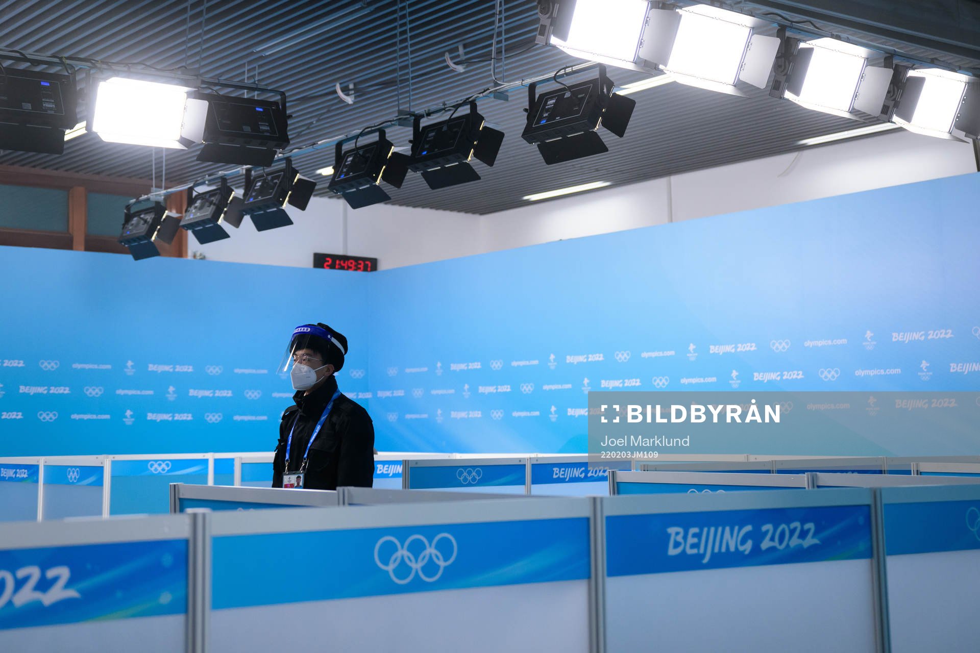 A man with personal protective gear stands guard in the