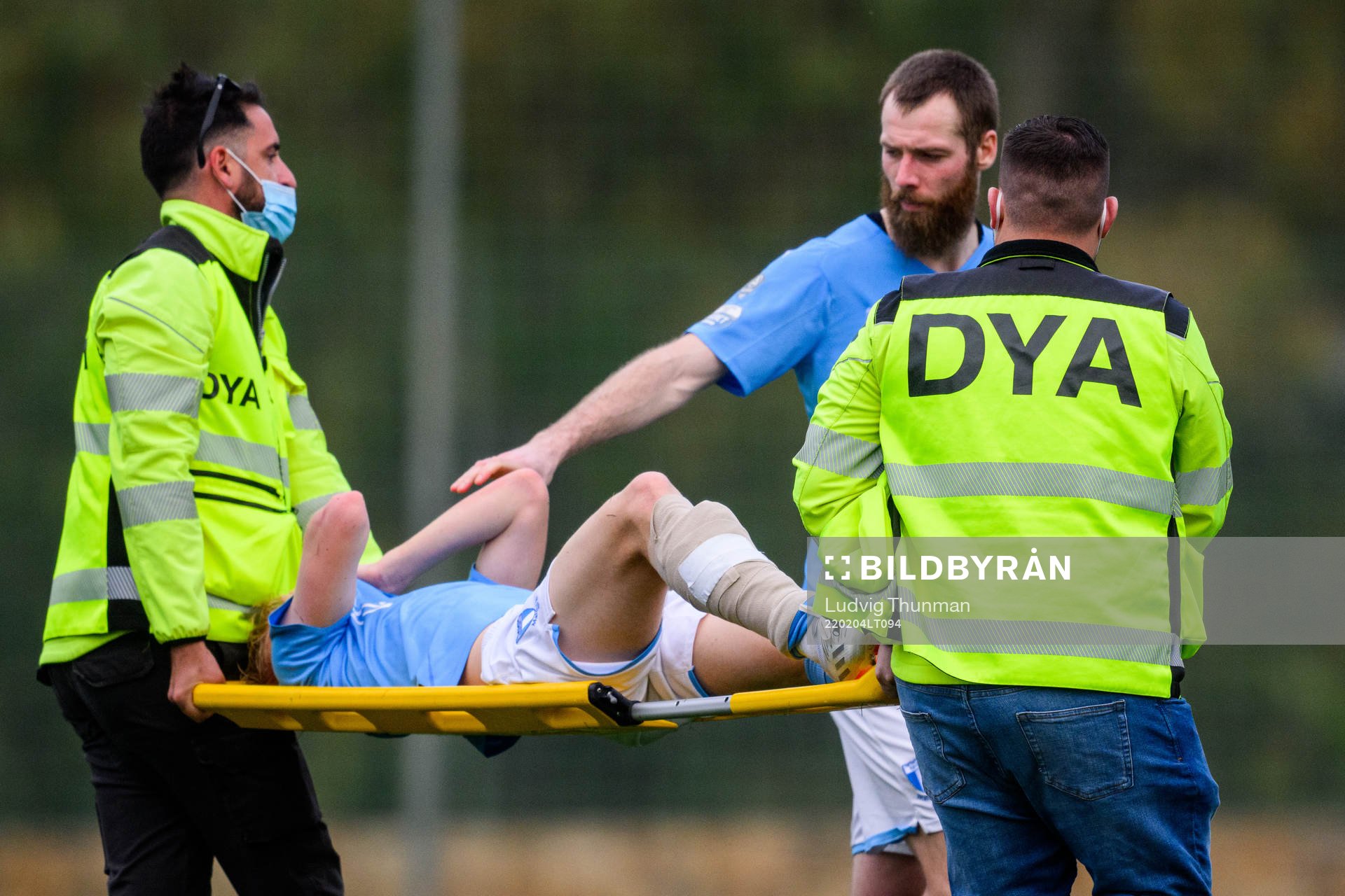 Jo Inge Berget of Malmö FF and injured Emil Lindman