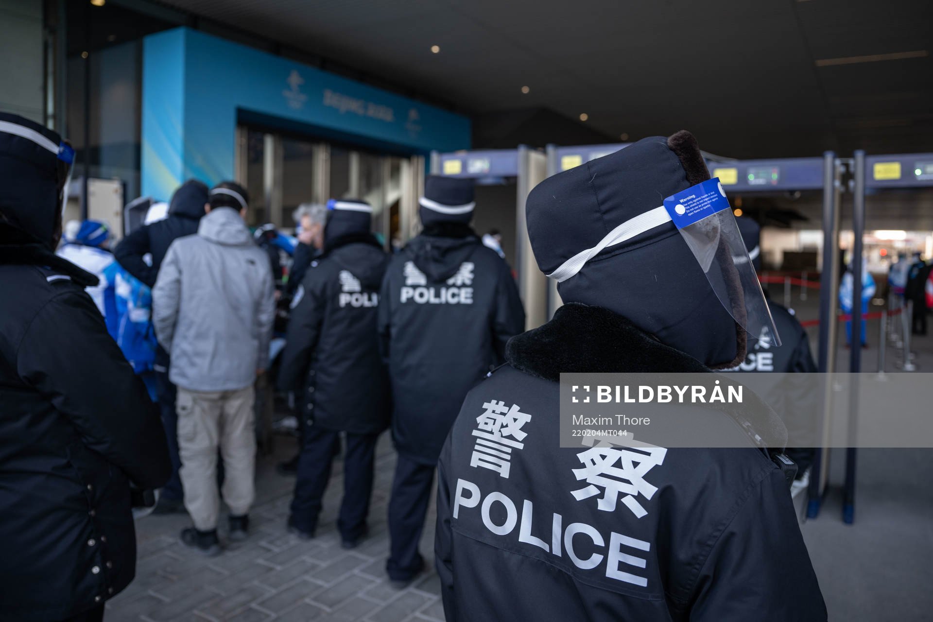 Police officers at a security check outside of Main Media