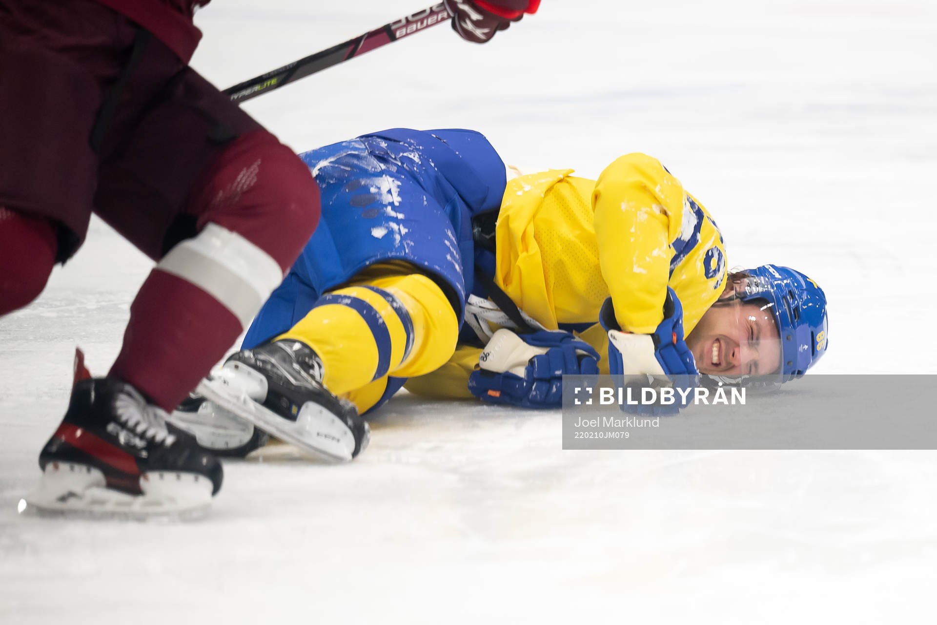 Mathias Bromé of Sweden in pain in an ice hockey