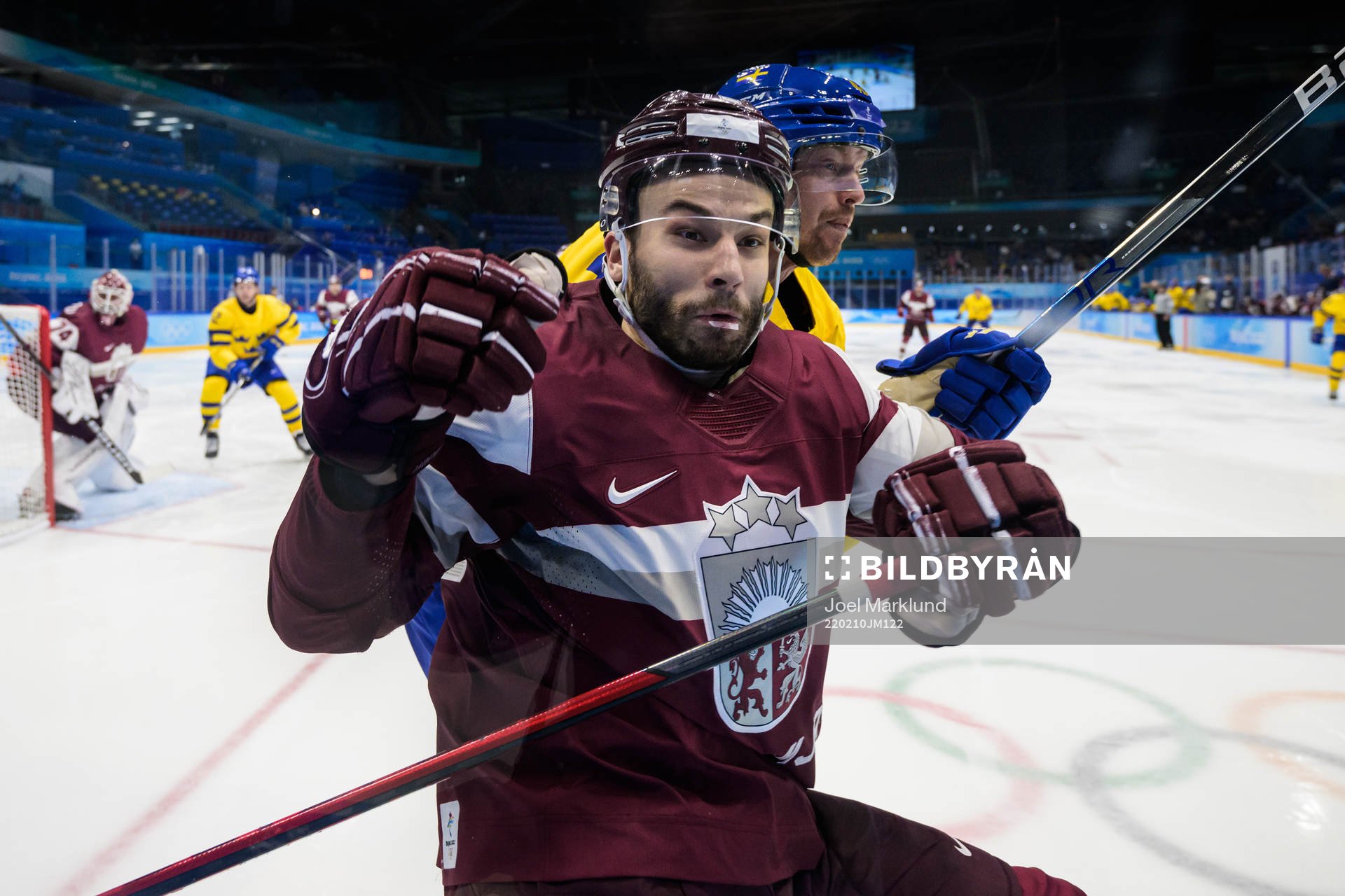 Janis Jaks of Latvia is being tackled by Joakim Nordström