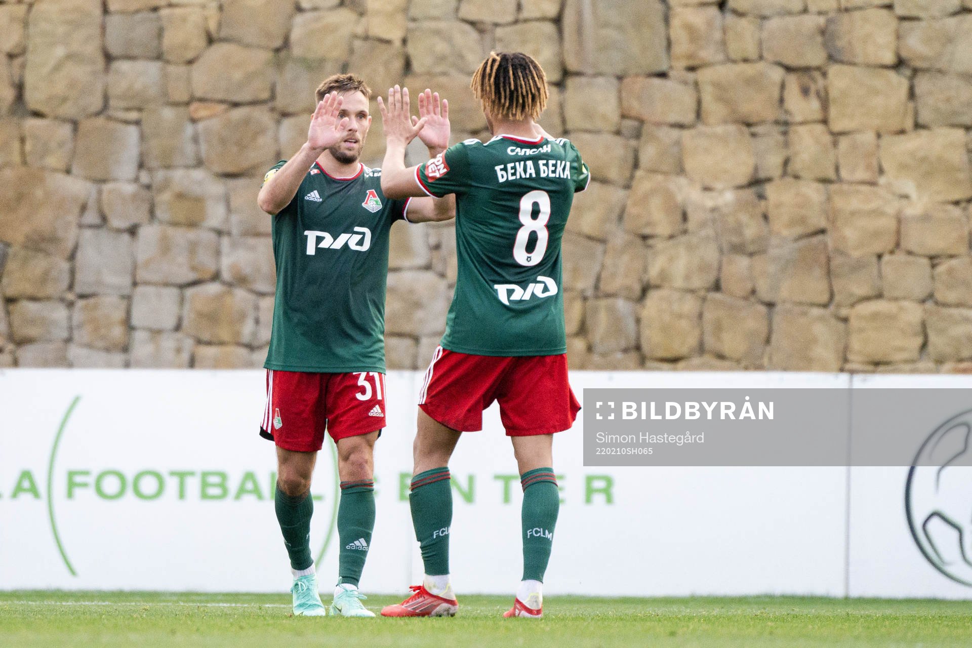 Maciej Rybus and Alexis Beka Beka of Lokomotiv Moscow