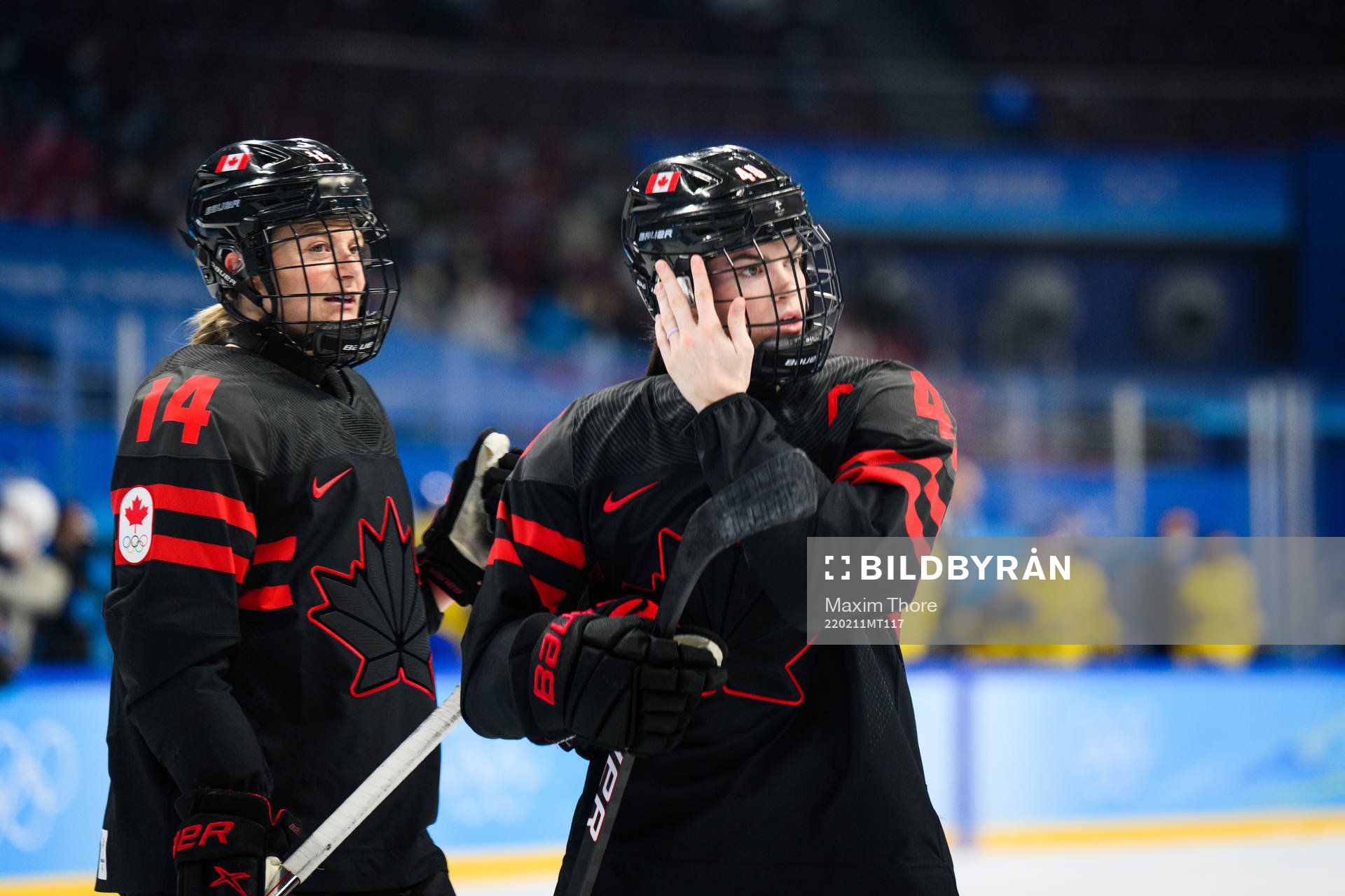Renata Fast and Blayre Turnbull of Canada in an ice hockey
