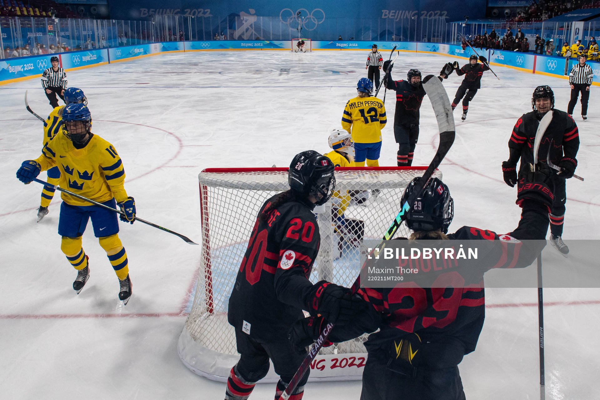 Players of Canada celebrates while goaltender Emma