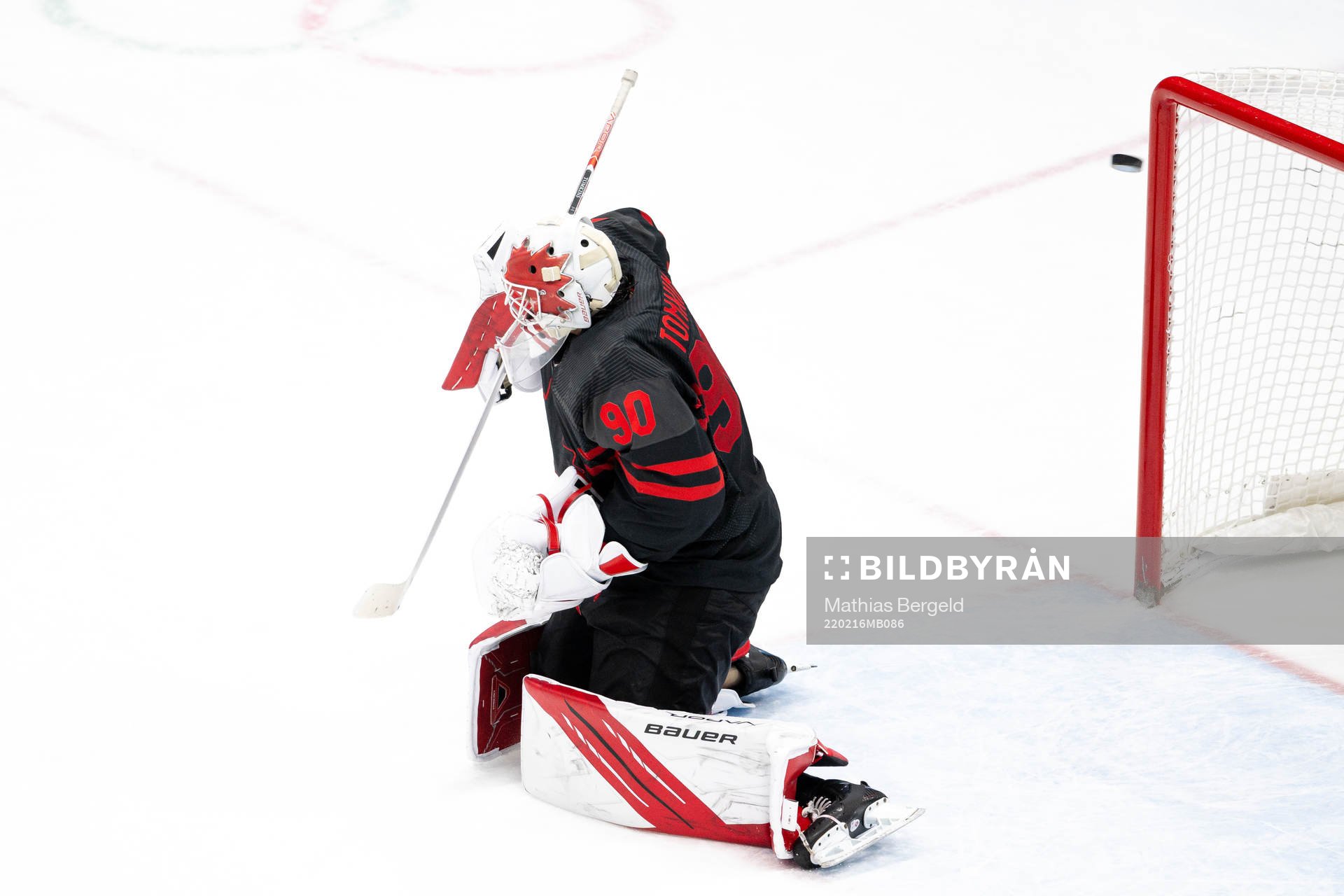 Goaltender Matt Tomkins of Canada let’s in the 1-0 goal