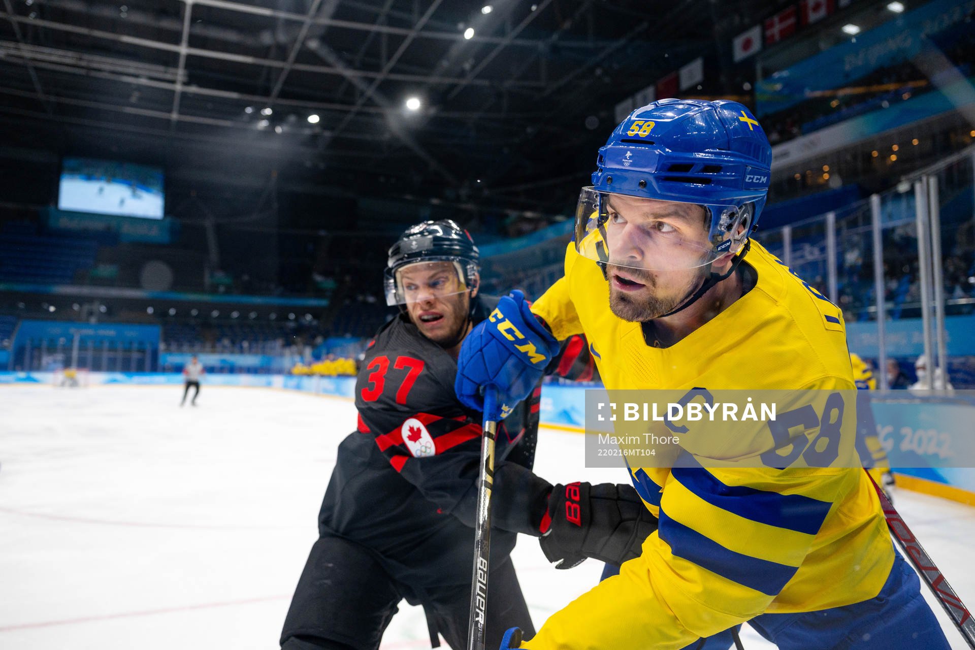 Mat Robinson of Canada and Anton Lander of Sweden in the