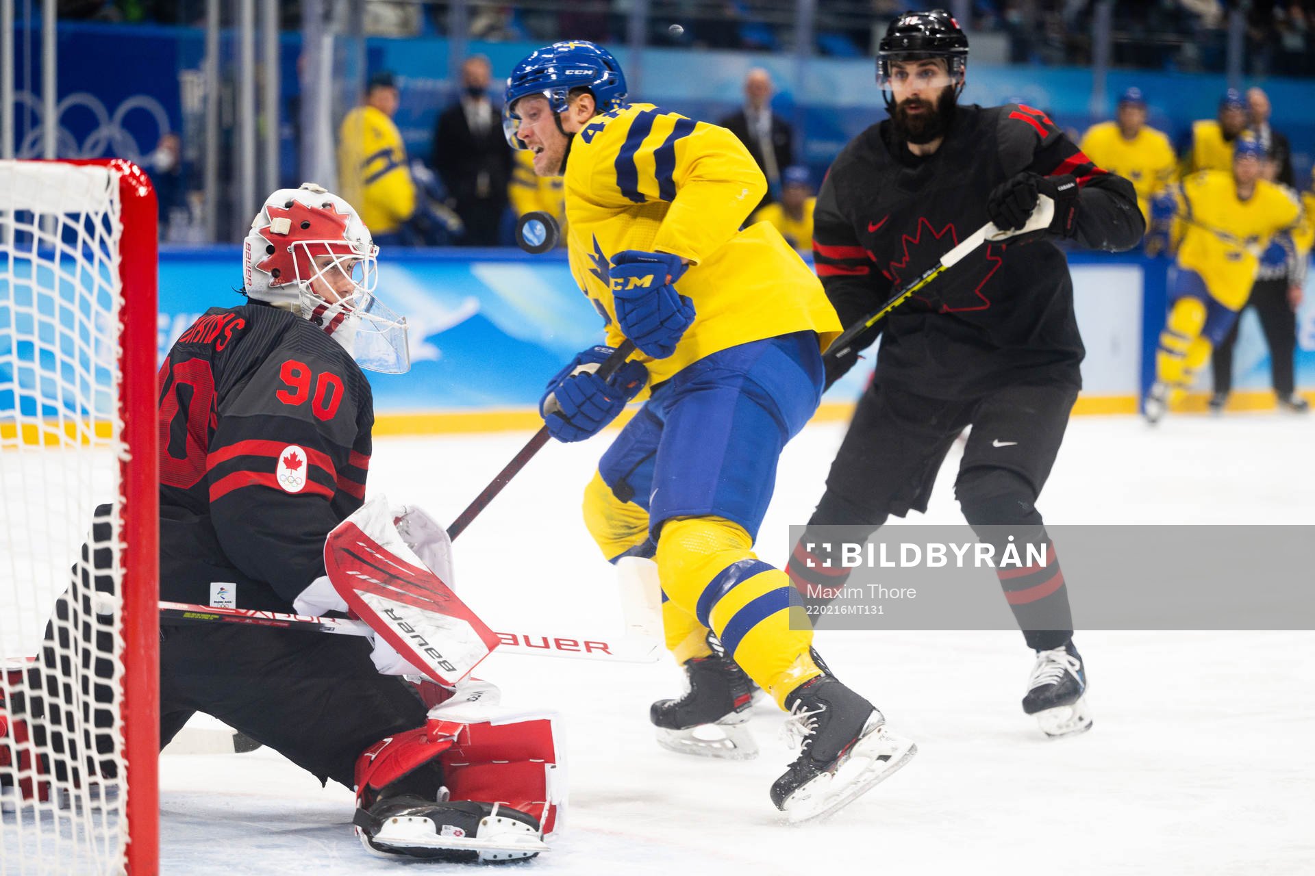 Carl Klingberg of Sweden against goaltender Matt Tomkins