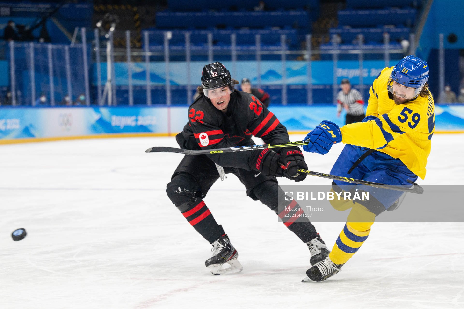 Owen Power of Canada and Linus Johansson of Sweden in the