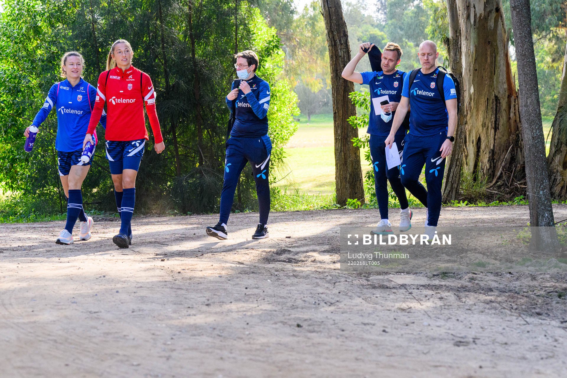 Synne Skinnes Hansen, goalkeeper Cecilie Hauståker Fiskerstrand, Martin Sjögren, head coach and Anders Jacobson, assistant coach of Norway head for a training session with the Norwegian women's national football team on February 18, 2022 in Alvor.