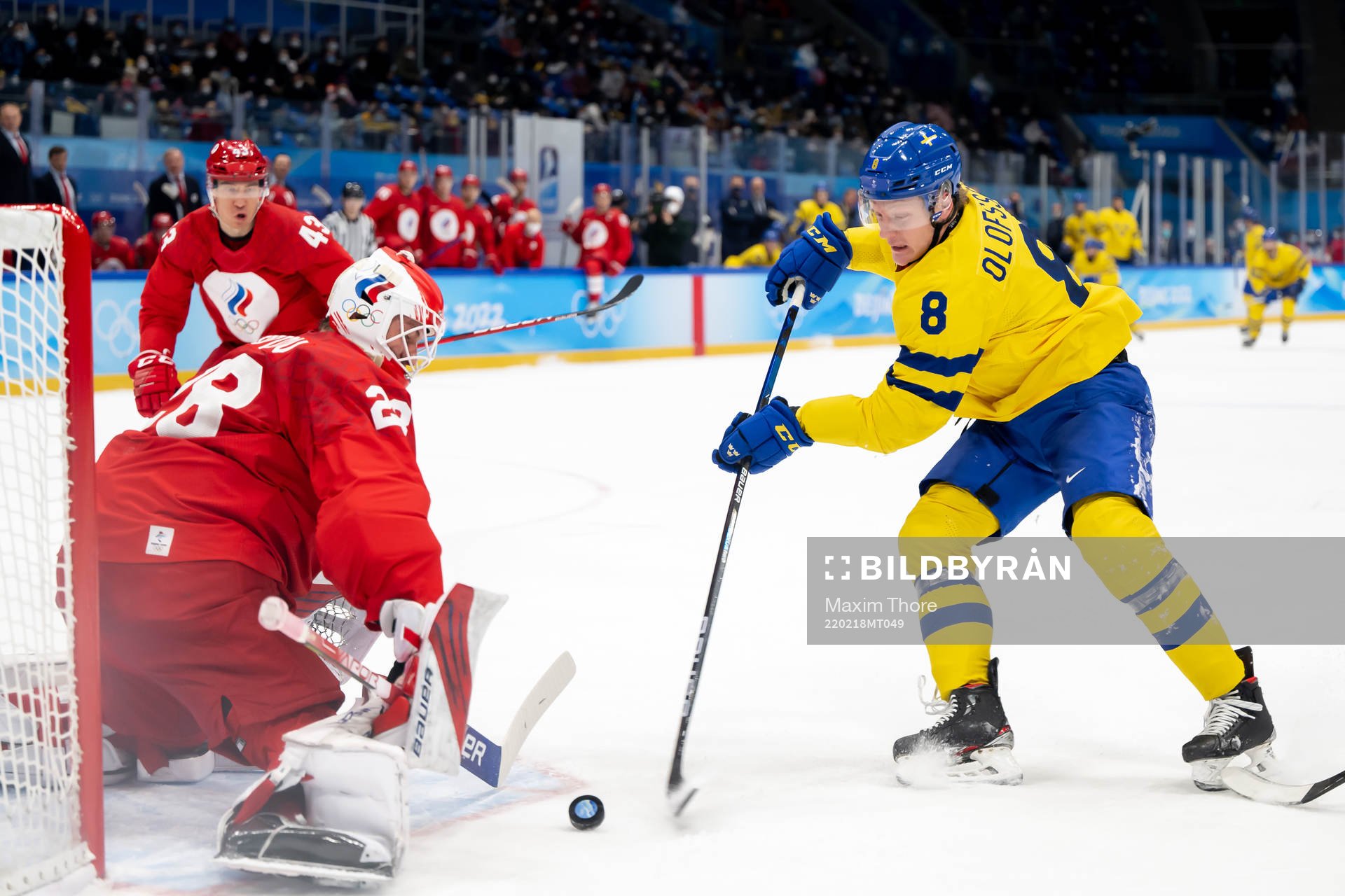 Goaltender Ivan Fedotov of Russia and Fredrik Olofsson of