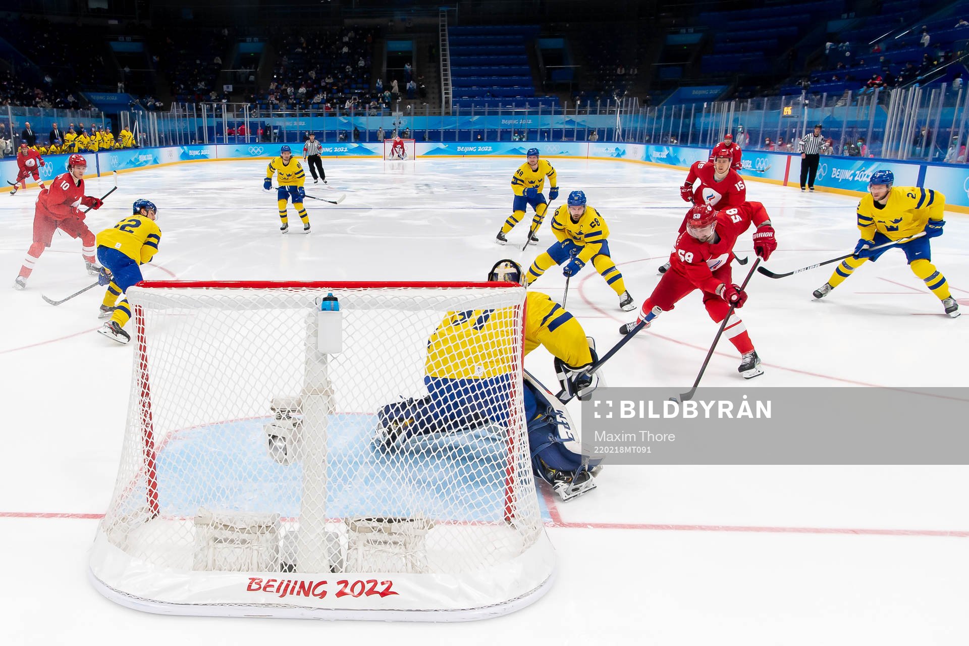 Goaltender Lars Johansson of Sweden and Anton Slepyshev of