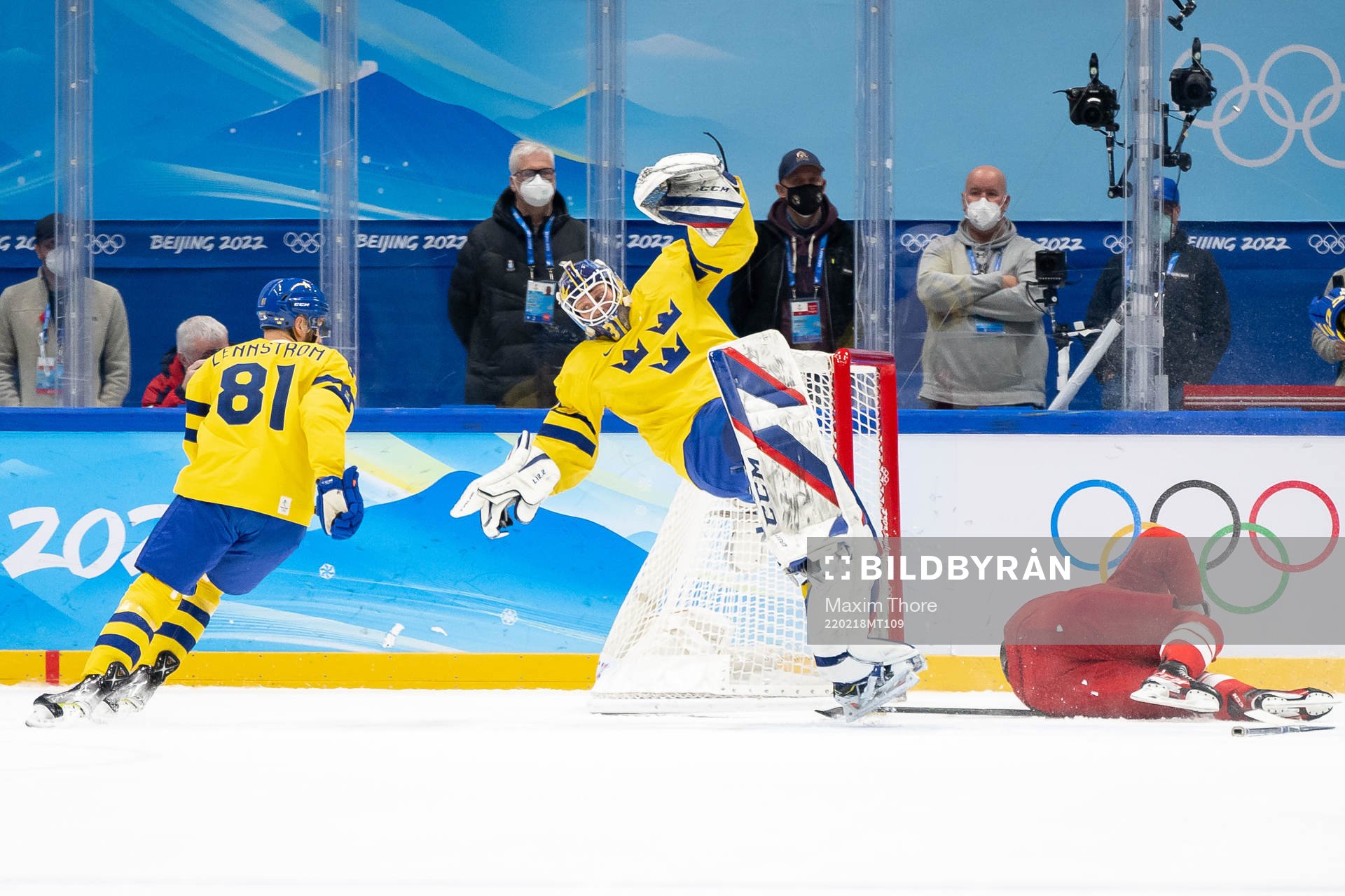 Goaltender Lars Johansson of Sweden and Pavel Karnaukhov of
