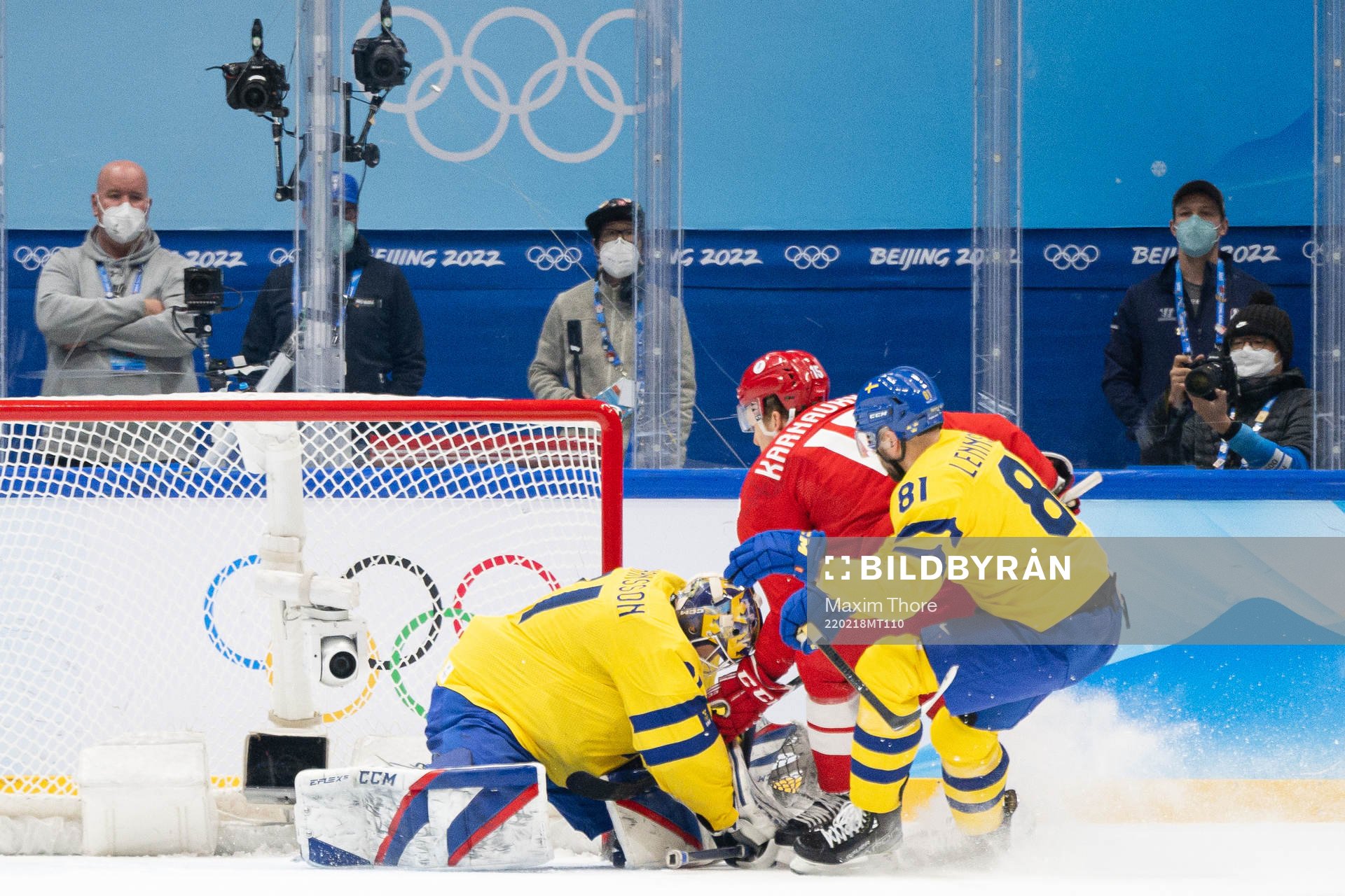 Goaltender Lars Johansson of Sweden and Pavel Karnaukhov of