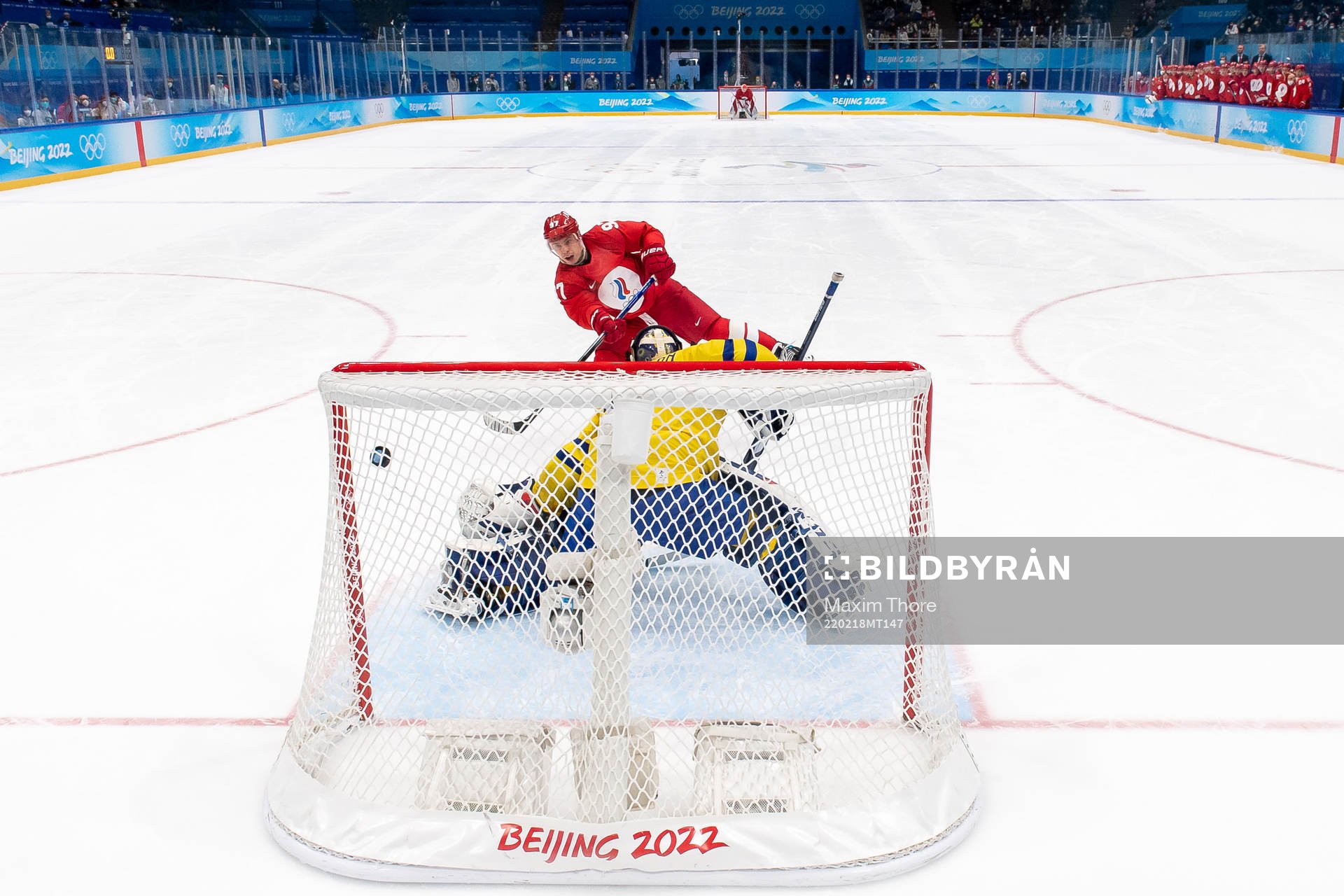 Nikita Gusev of Russia against goaltender Lars Johansson of