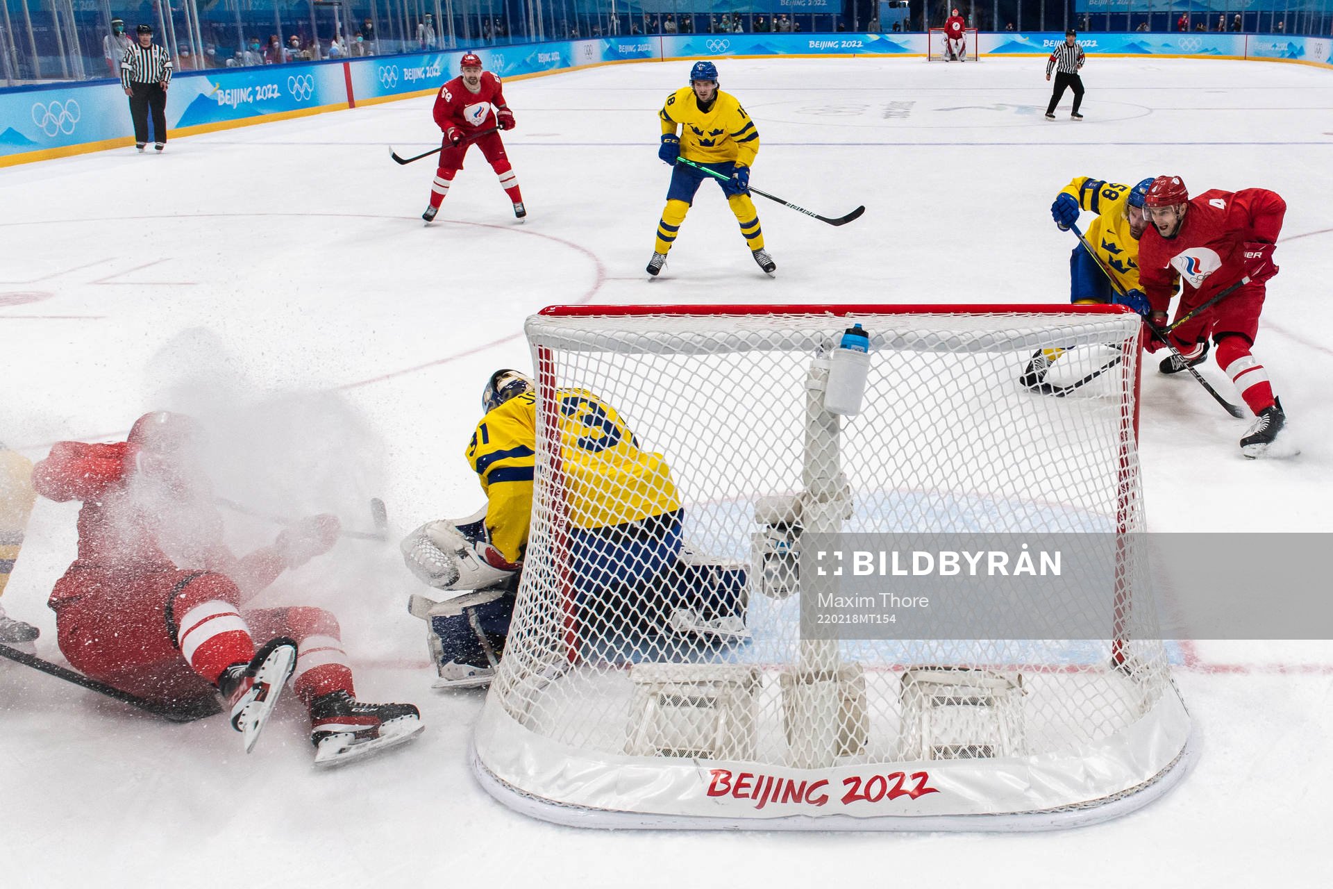 Pavel Karnaukhov of Russia and goaltender Lars Johansson of