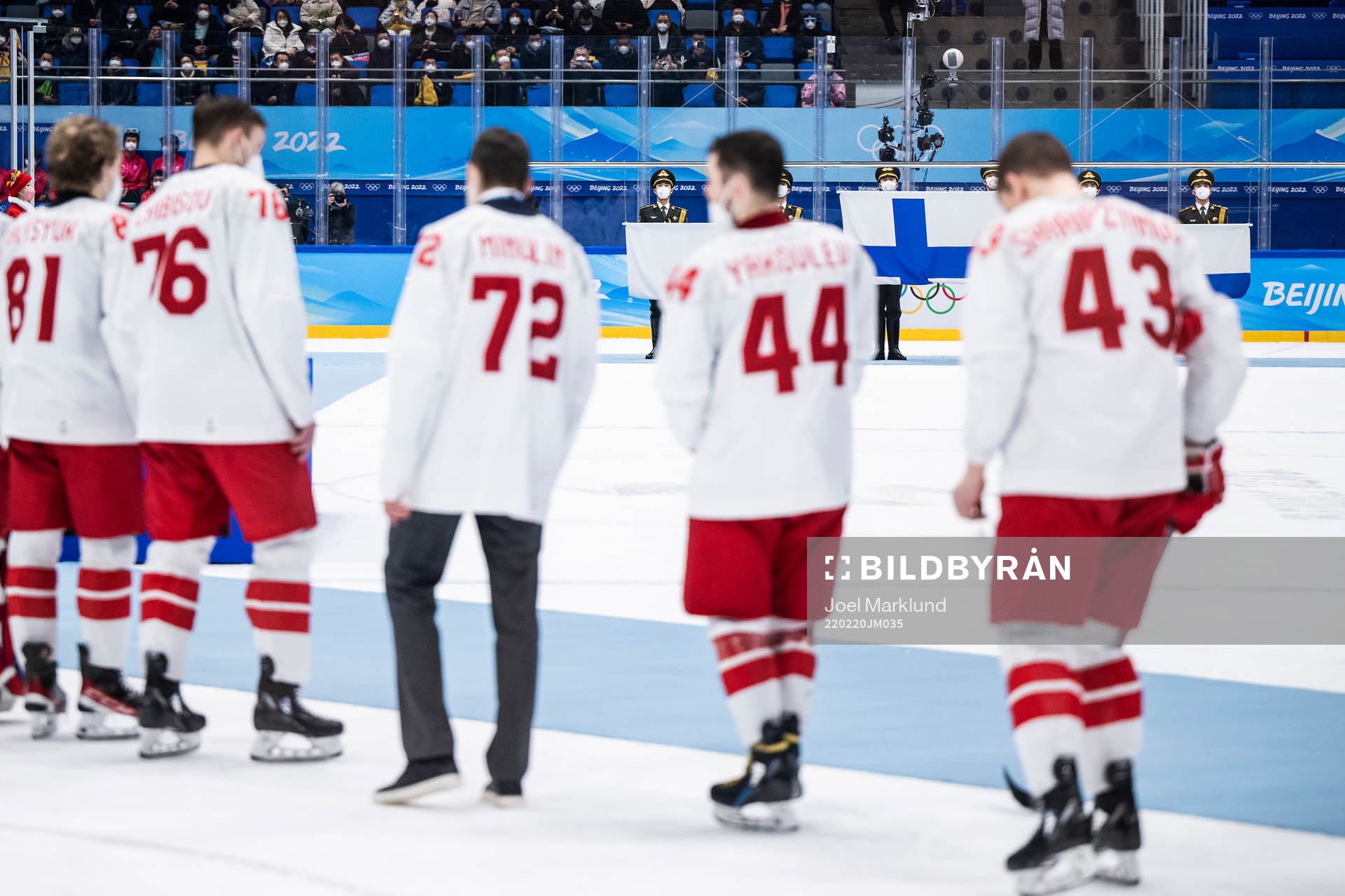 The flag of Finland is shown behind players of Russia