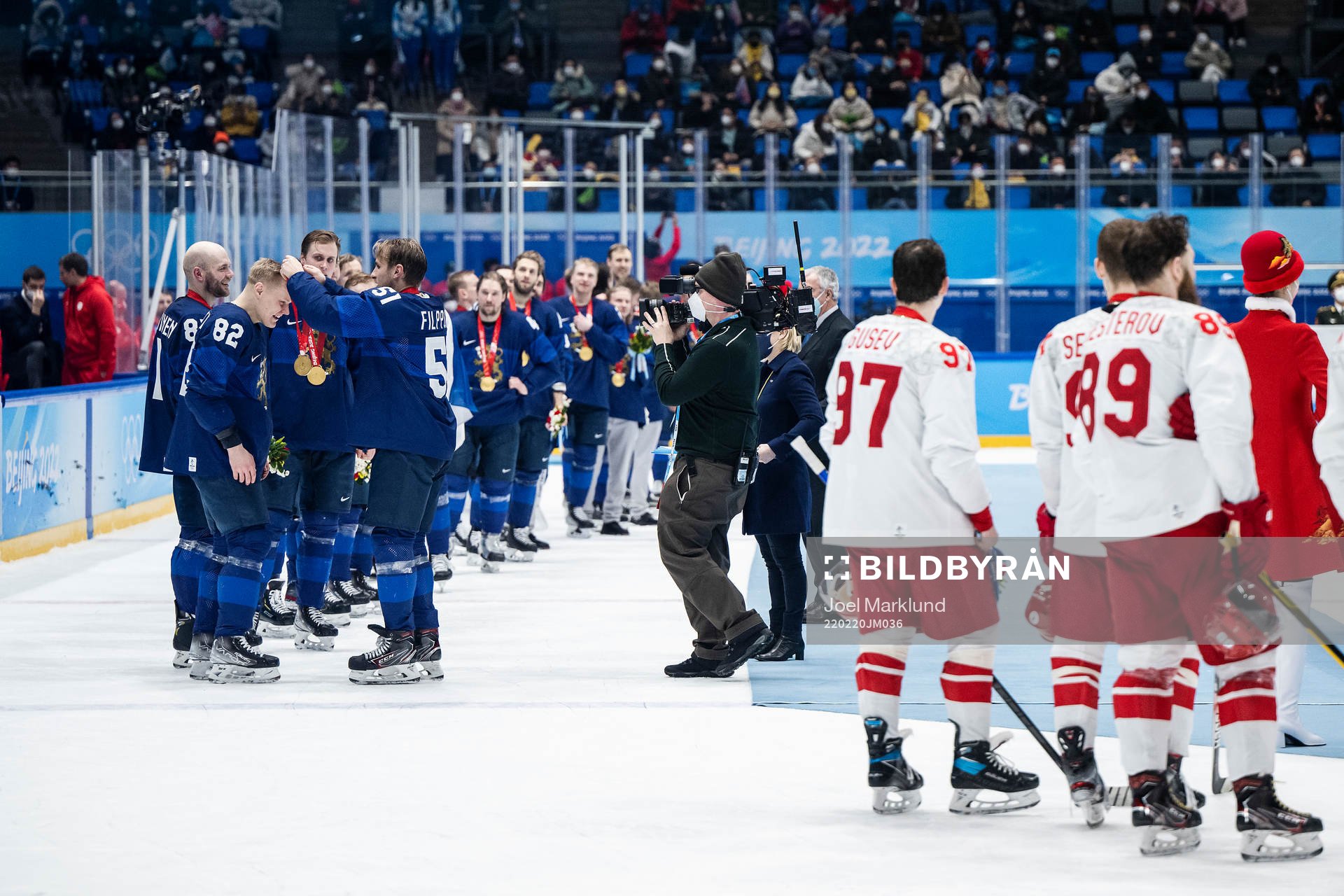 Harri Pesonen of Finland receives his gold medal from