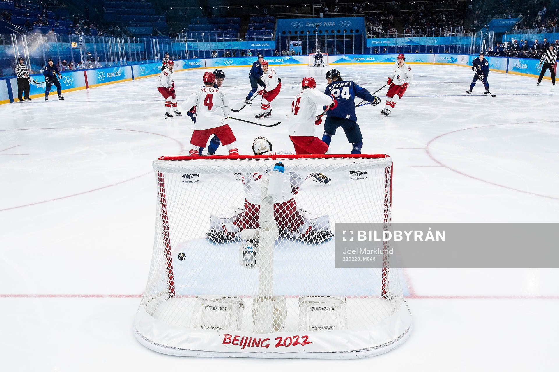 Hannes Björninen of Finland scores 2-1 behind goaltender