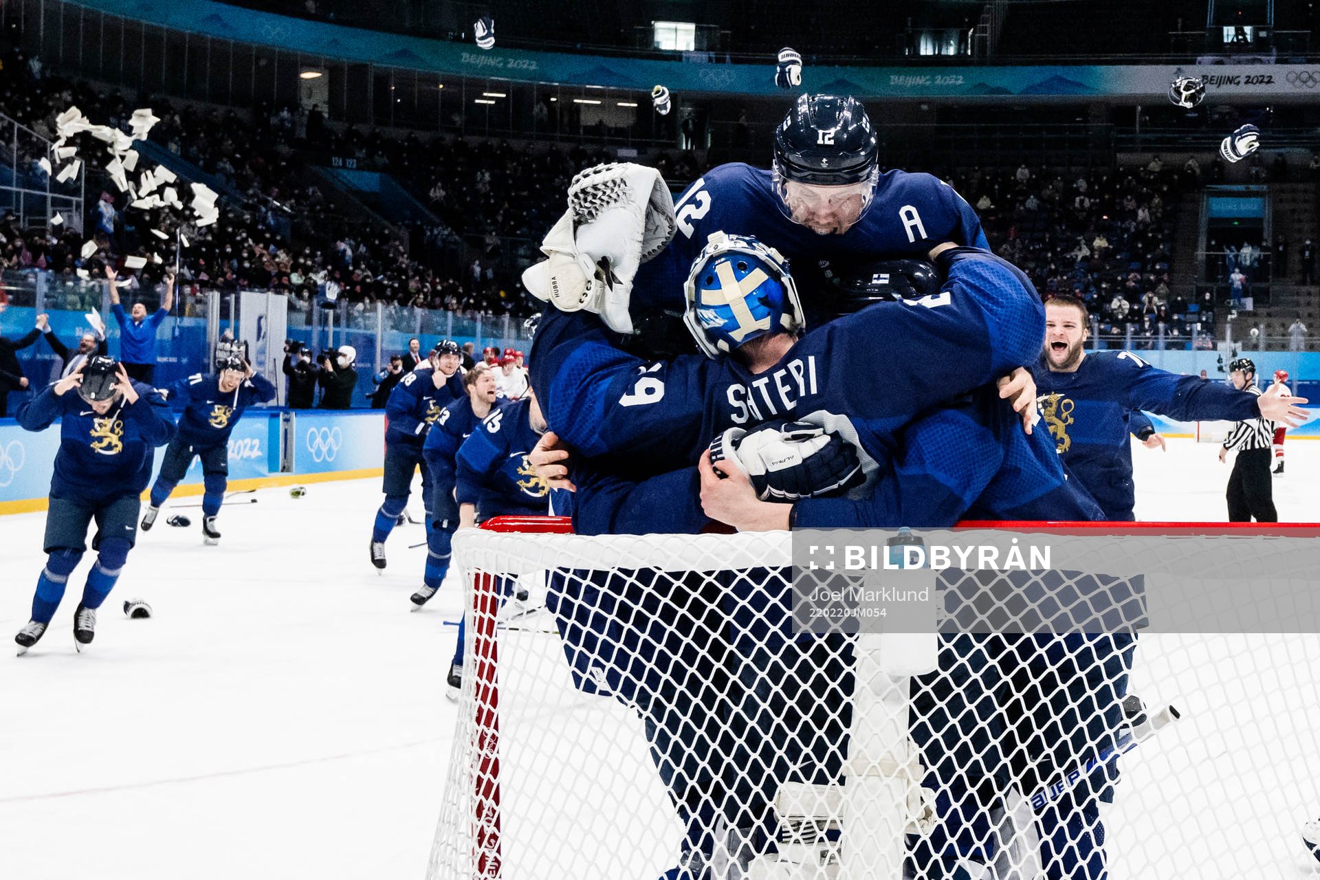 Marko Anttila of Finland celebrate with goaltender Harri