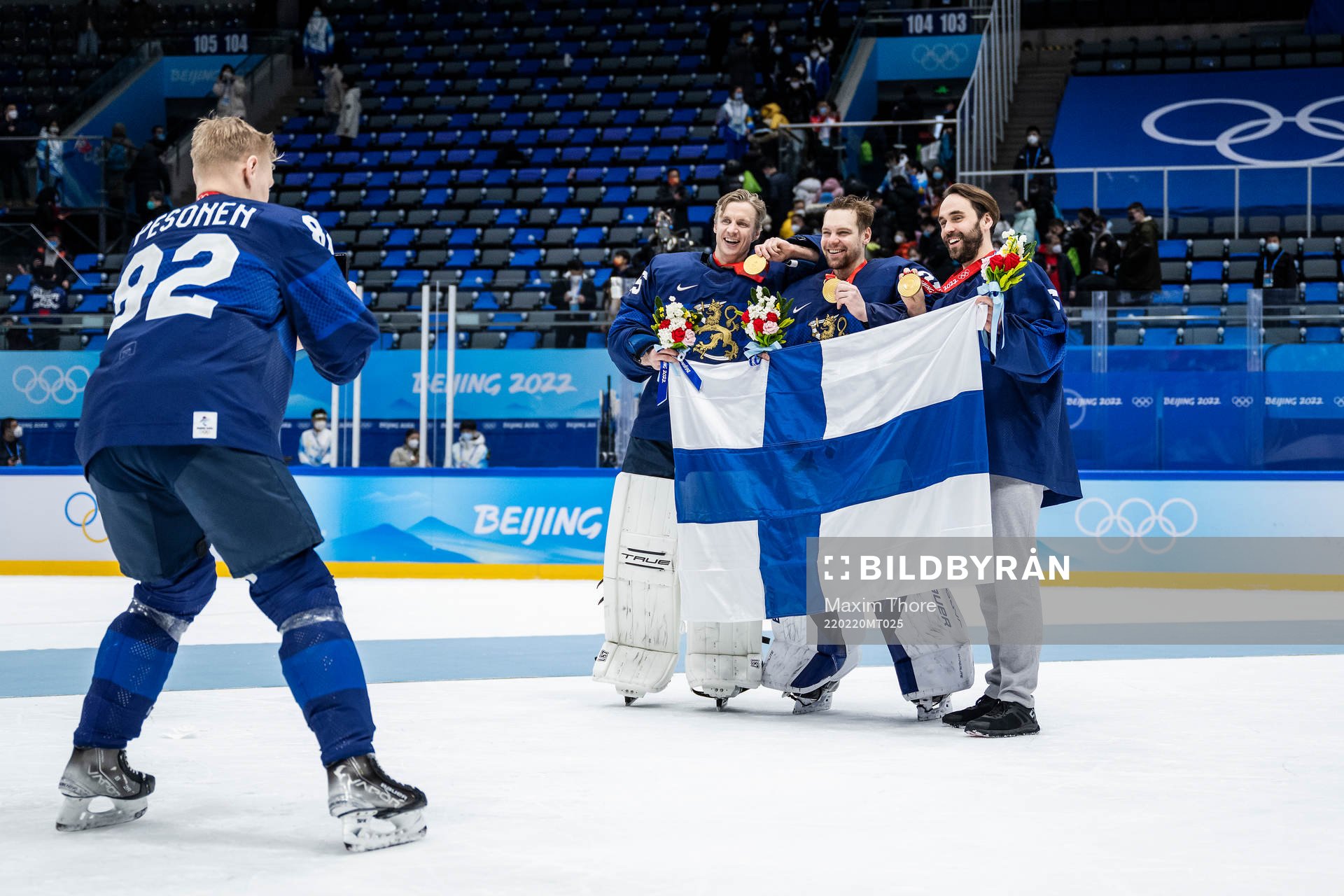 Harri Pesonen of Finland takes a photo of goaltenders Jussi