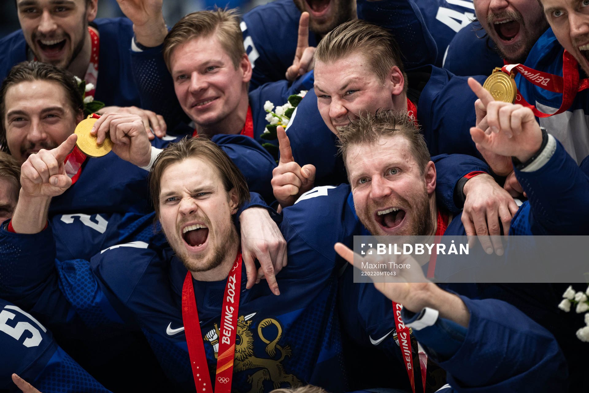 Mikko Lehtonen and Leo Komarov of Finland celebrate with