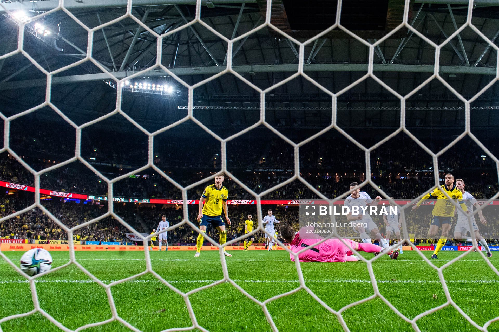 Robin Quaison of Sweden scores 1-0 behind goalkeeper Tomas