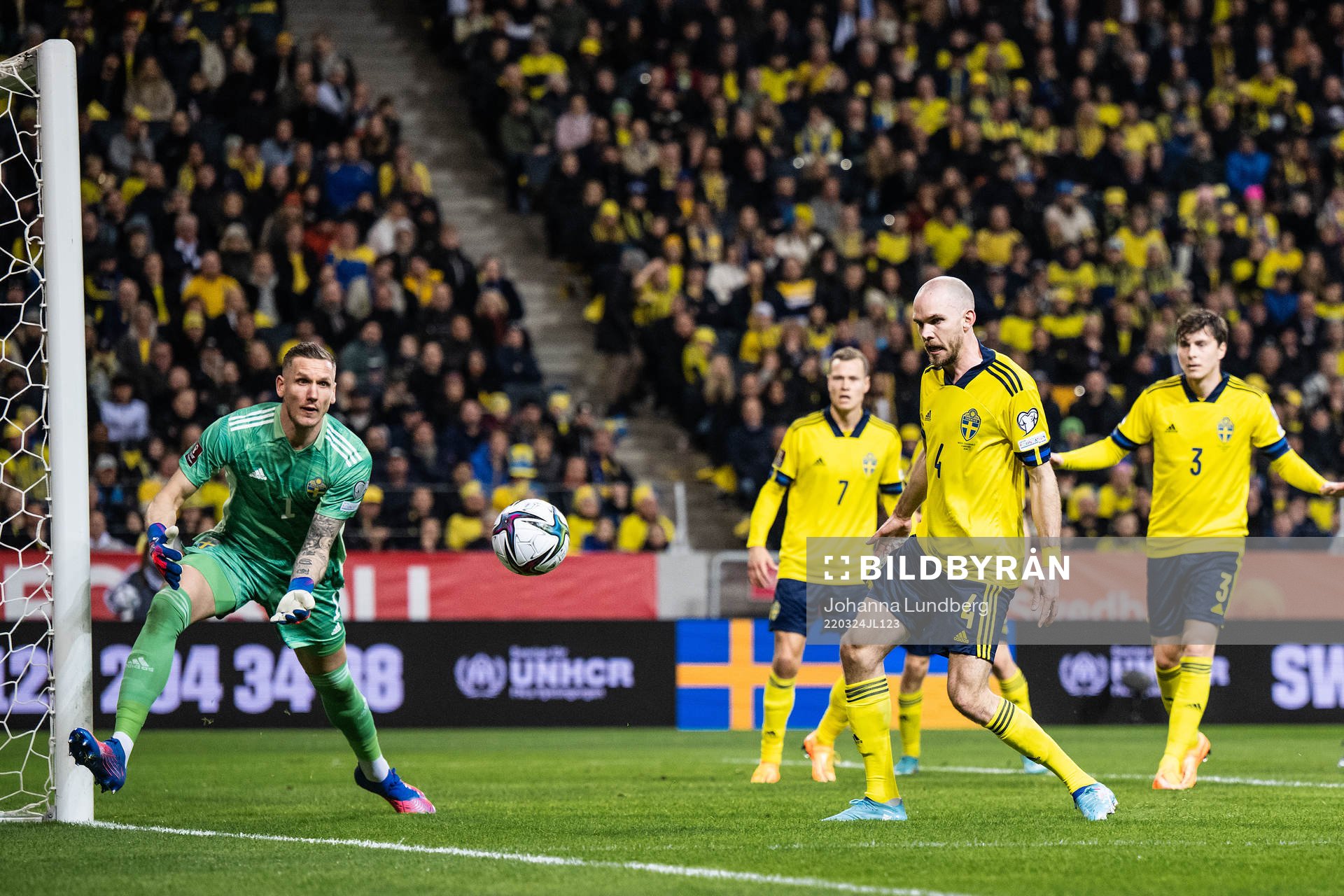 goalkeeper Robin Olsen and Marcus Danielson of Sweden