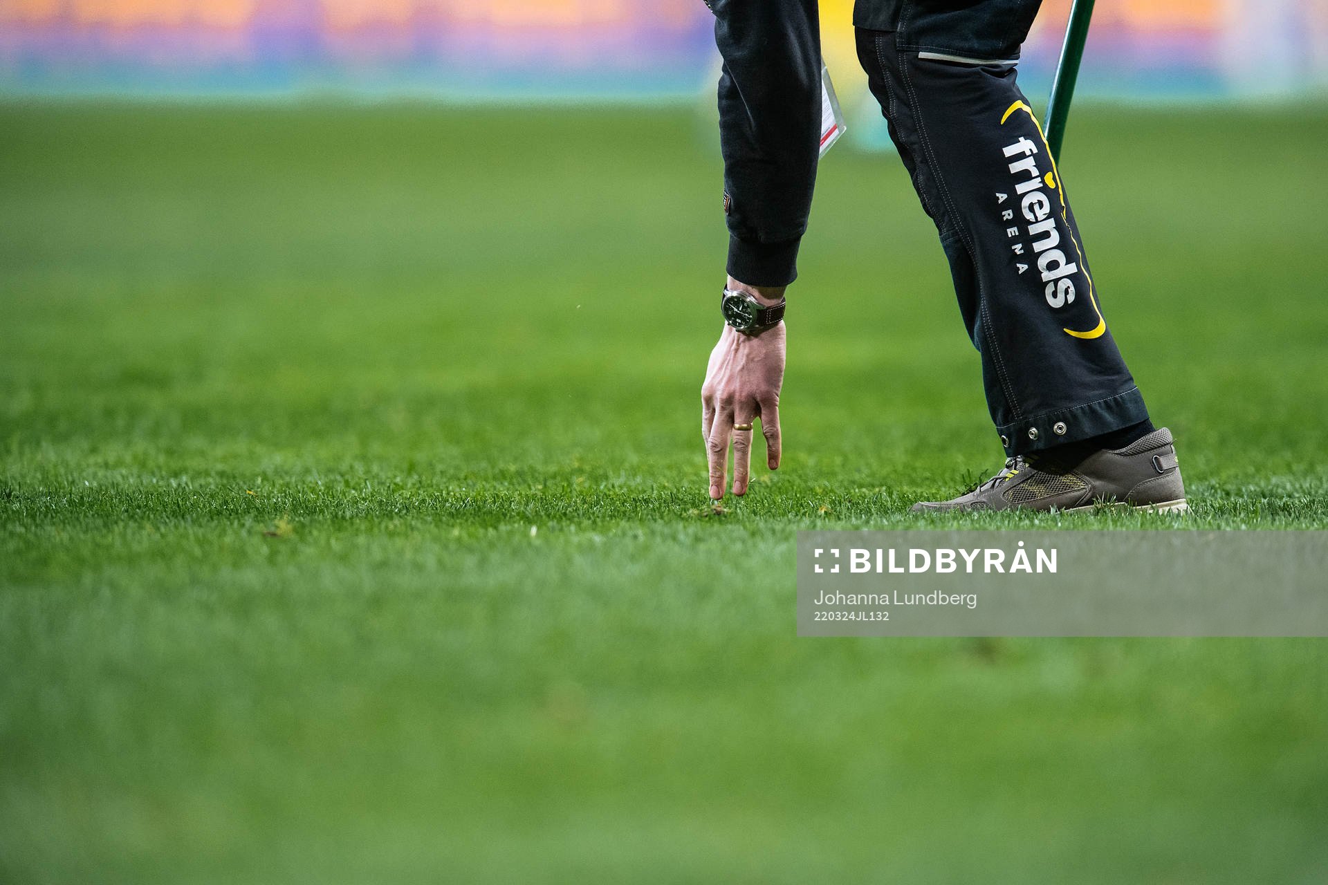 Ground staff inspects the pitch