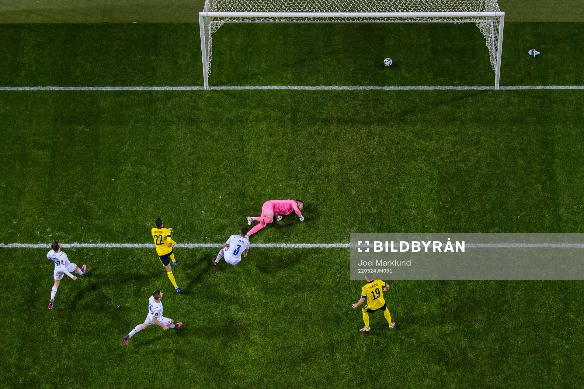 Robin Quaison of Sweden scores the 1-0 goal behind