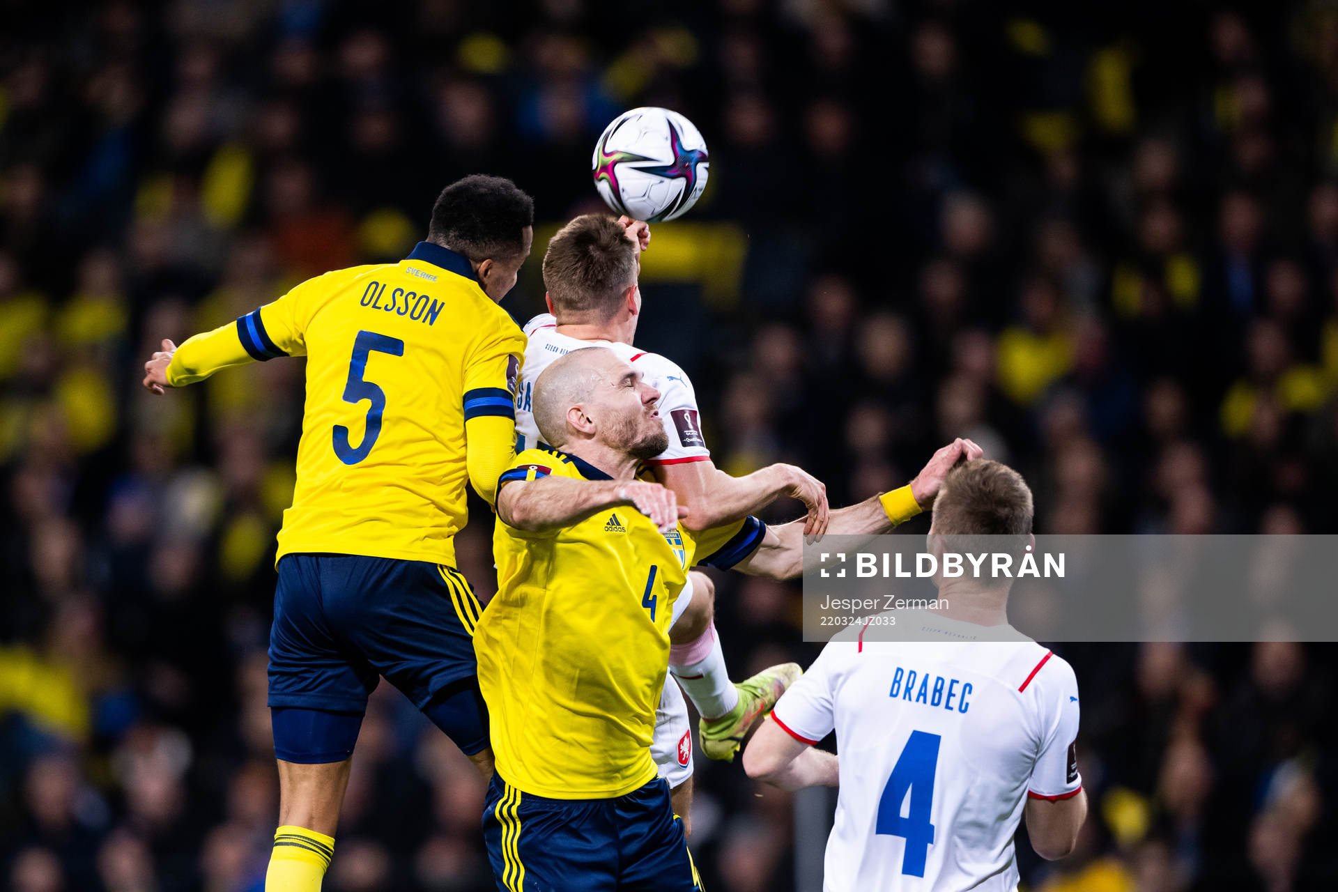 Martin Olsson and Marcus Danielson compete for the ball