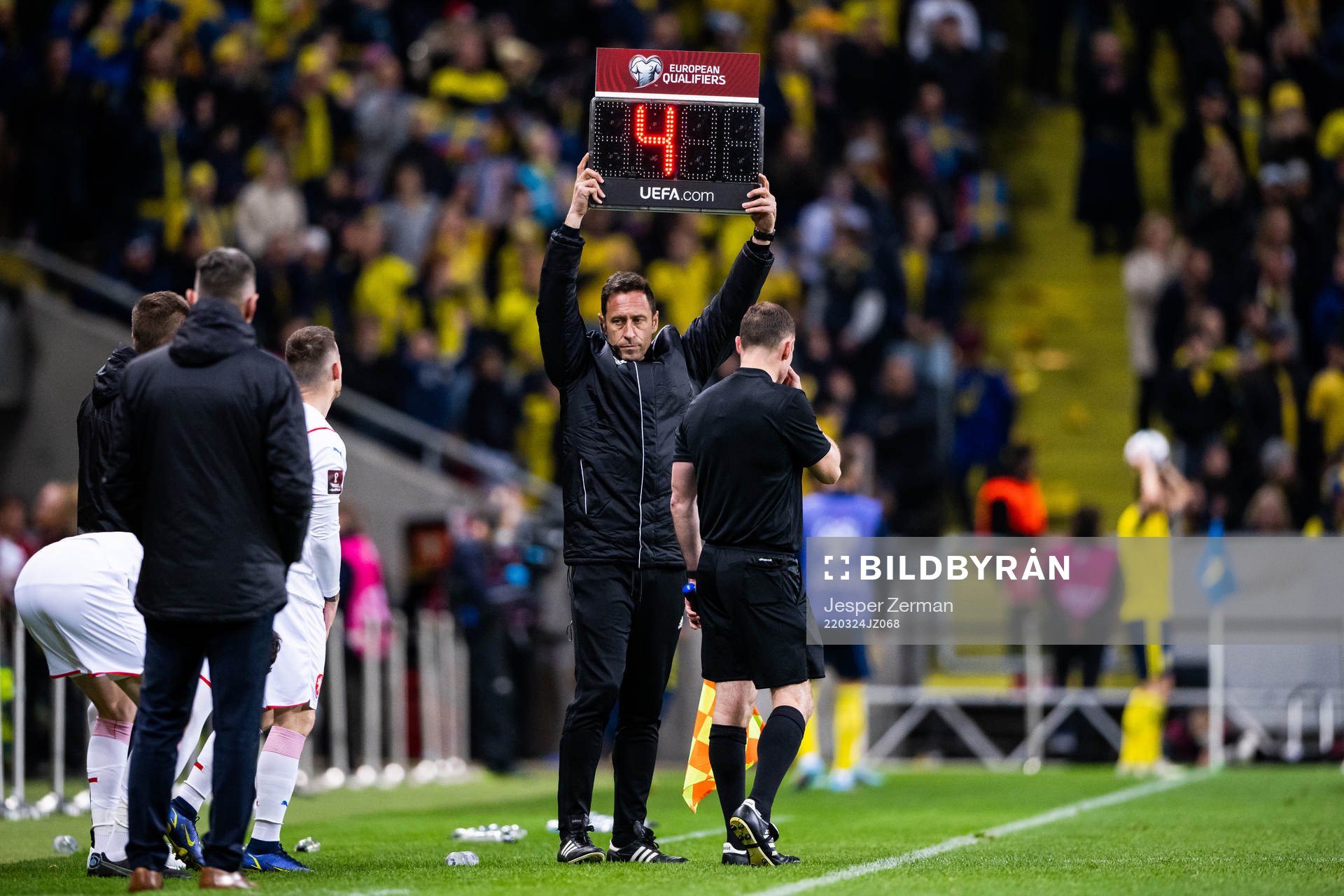 The fourth official shows four minutes of extra time