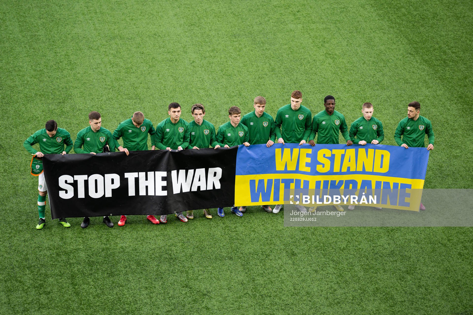 Players of Ireland with a banner
