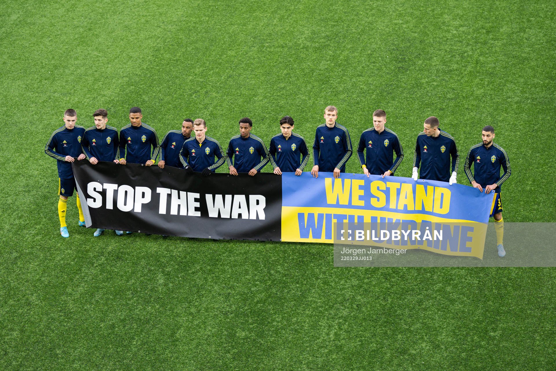 Players of Sweden with a banner