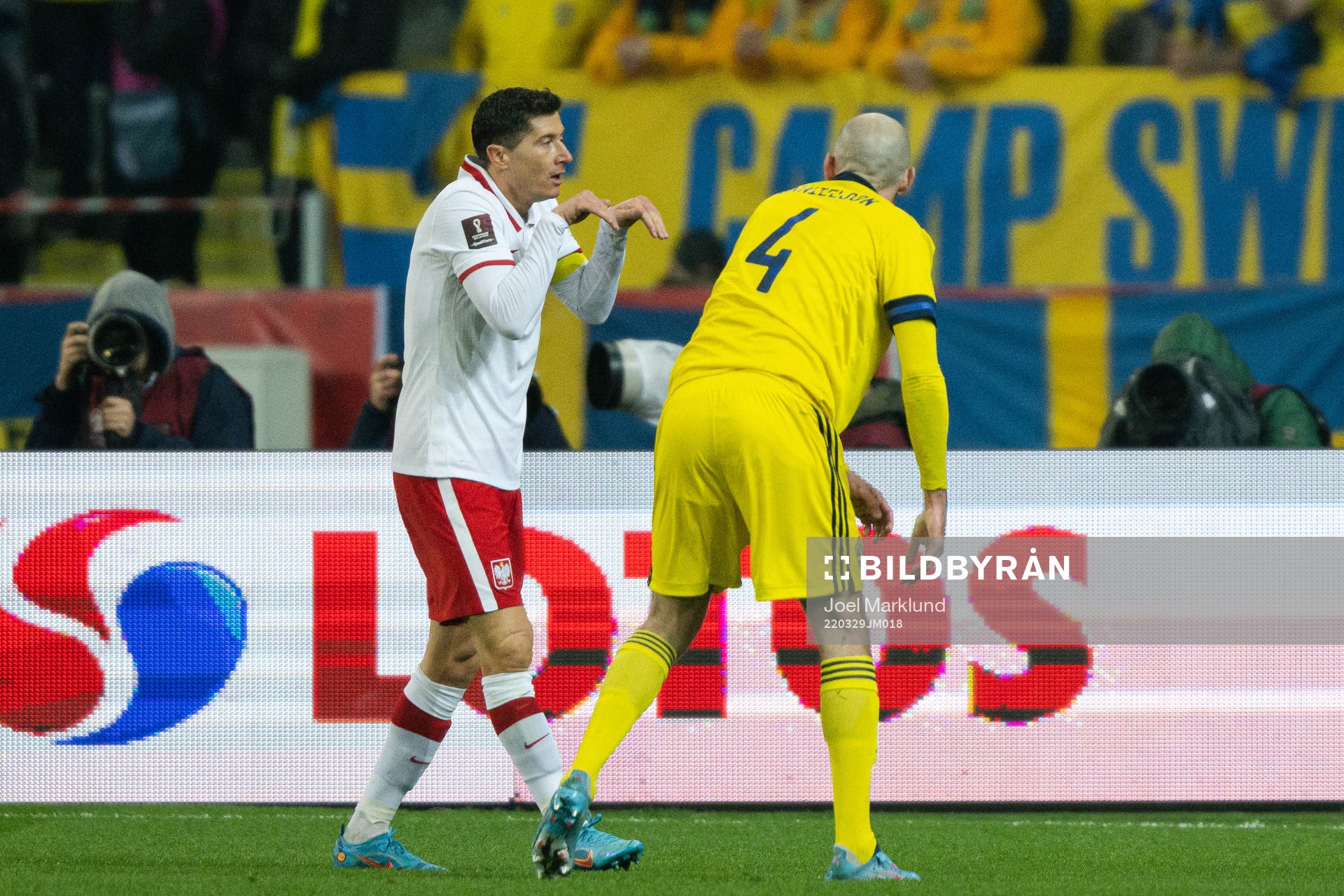 Robert Lewandowski of Poland ans Marcus Danielson of Sweden