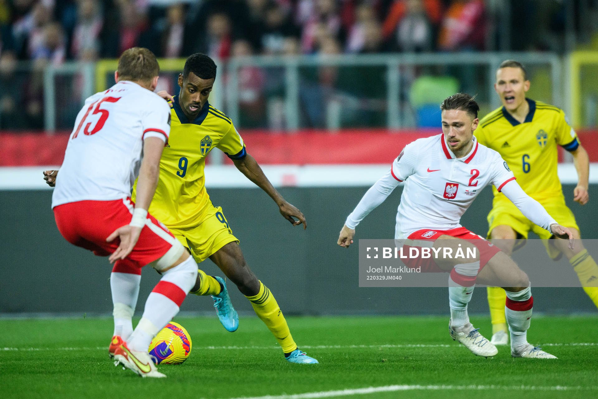 Alexander Isak of Sweden against Kamil Glik and Matty Cash
