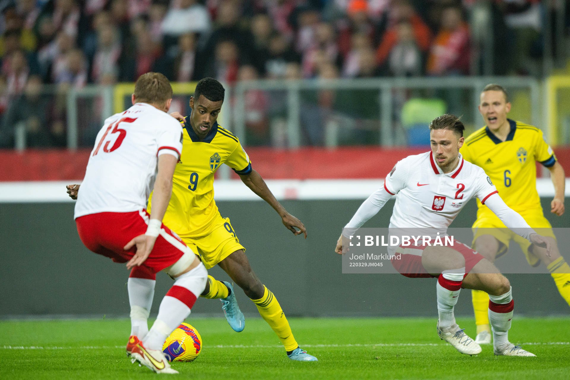 Alexander Isak of Sweden against Kamil Glik and Matty Cash