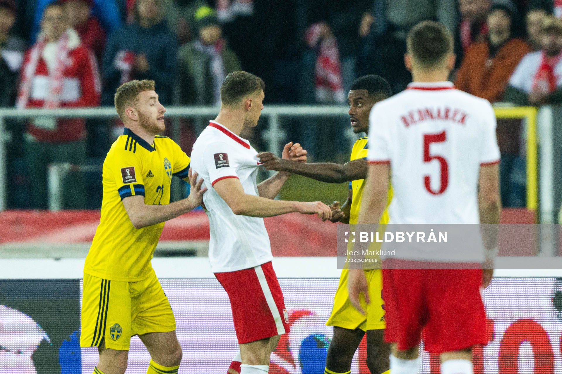 Krystian Bielik of Poland against Alexander Isak of Sweden