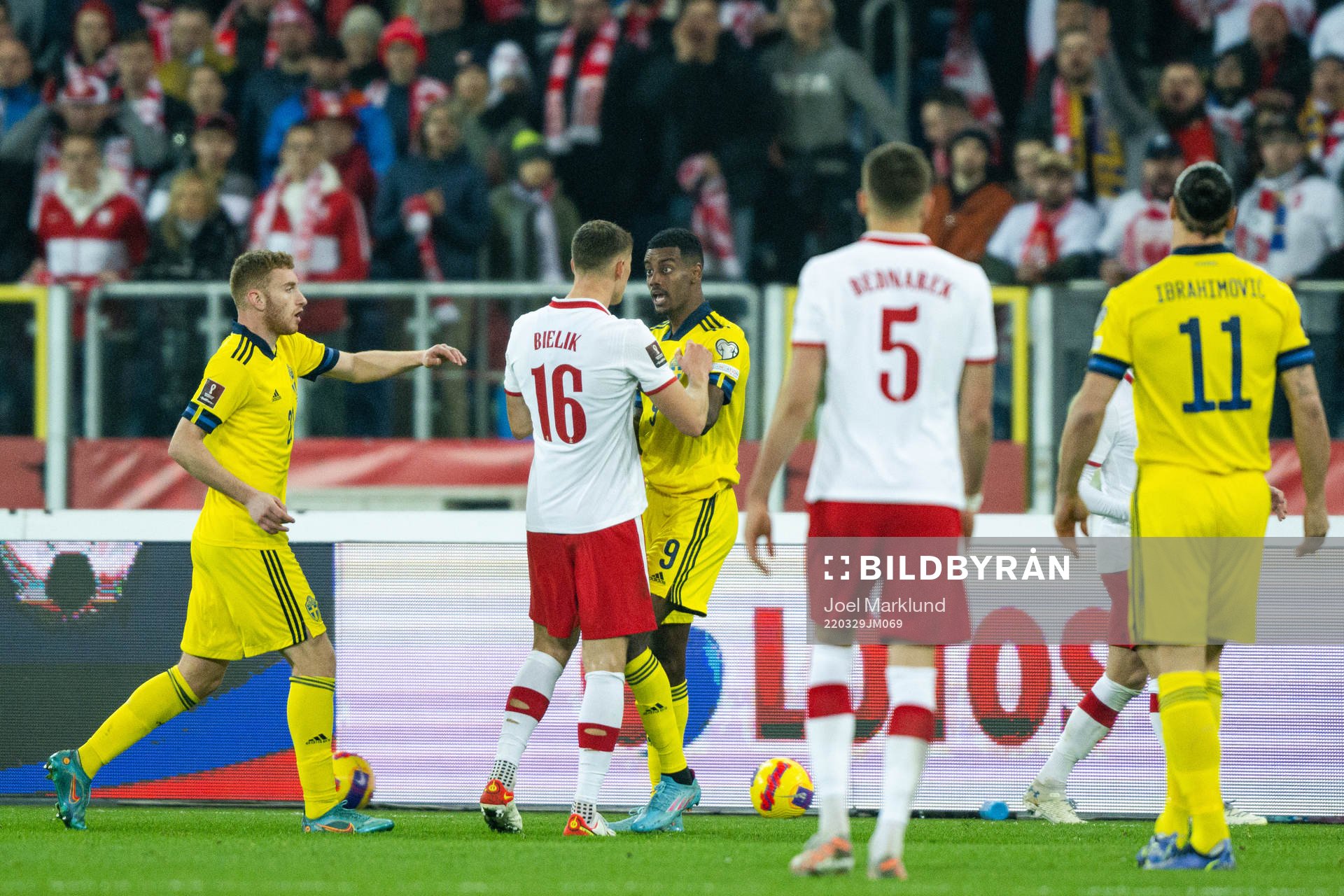 Krystian Bielik of Poland against Alexander Isak of Sweden