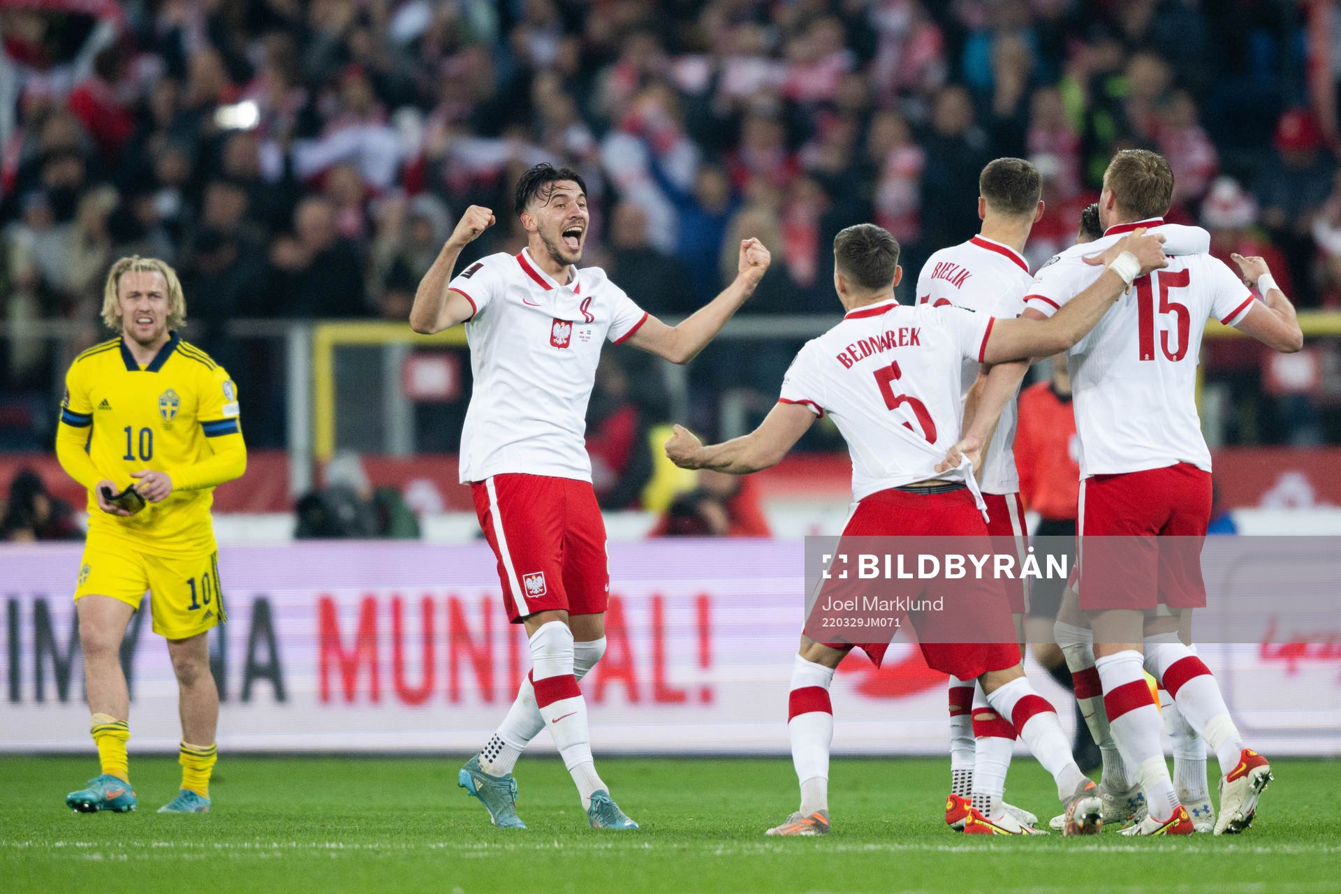 Players of Poland celebrate after the FIFA World Cup Qualifier play-off final between Poland and Sweden on March 29, 2022 in Katowice.
