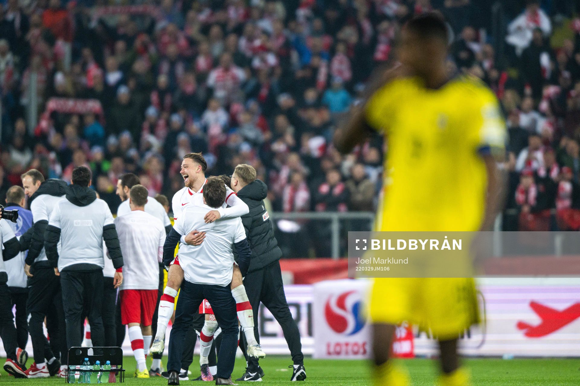 Players of Poland celebrate after the FIFA World Cup Qualifier play-off final between Poland and Sweden on March 29, 2022 in Katowice.