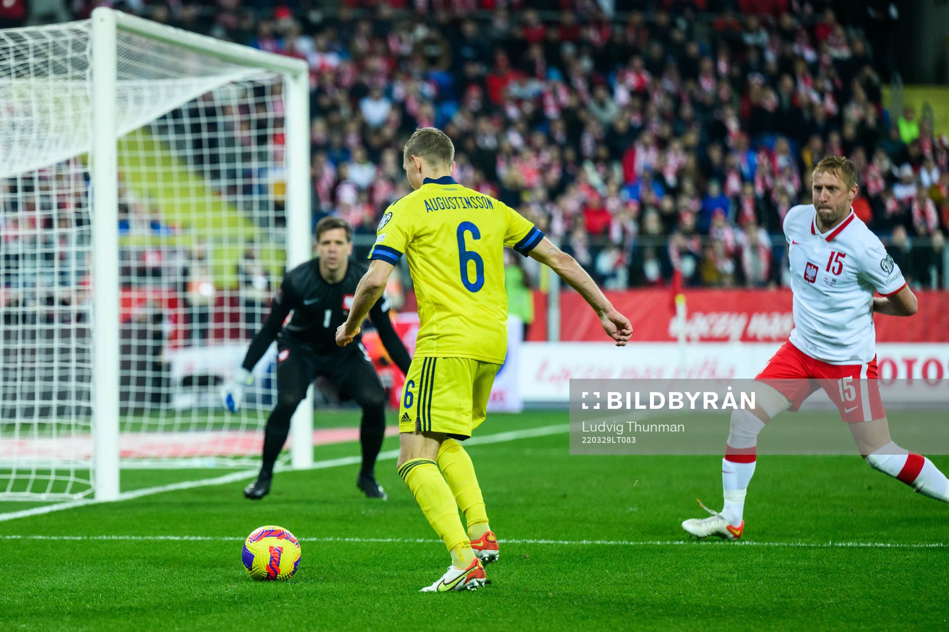 Ludwig Augustinsson of Sweden and goalkeeper Wojciech