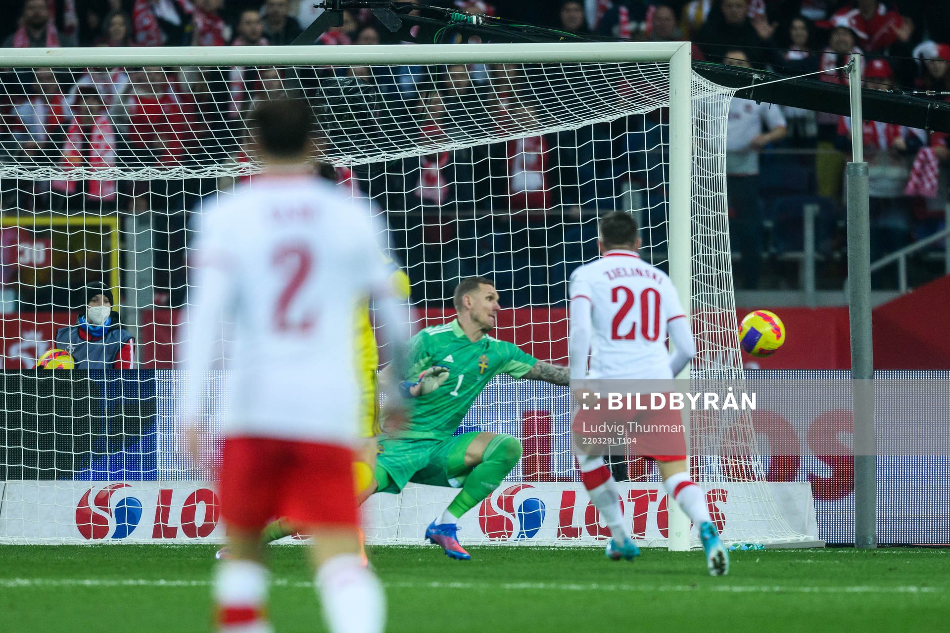 Piotr Zielinski of Poland scores 2-0 against goalkeeper