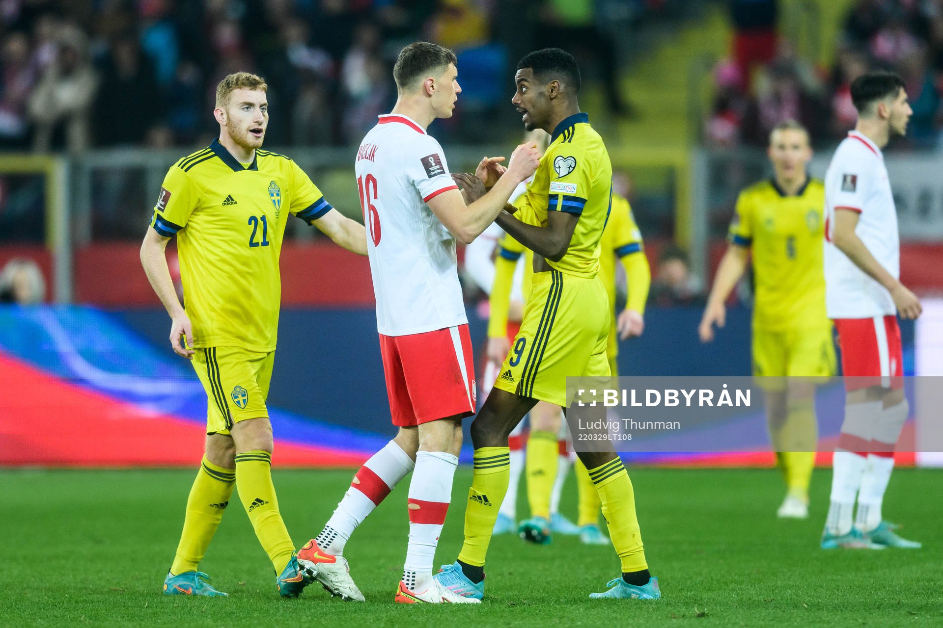 Krystian Bielik of Poland and Alexander Isak of Sweden
