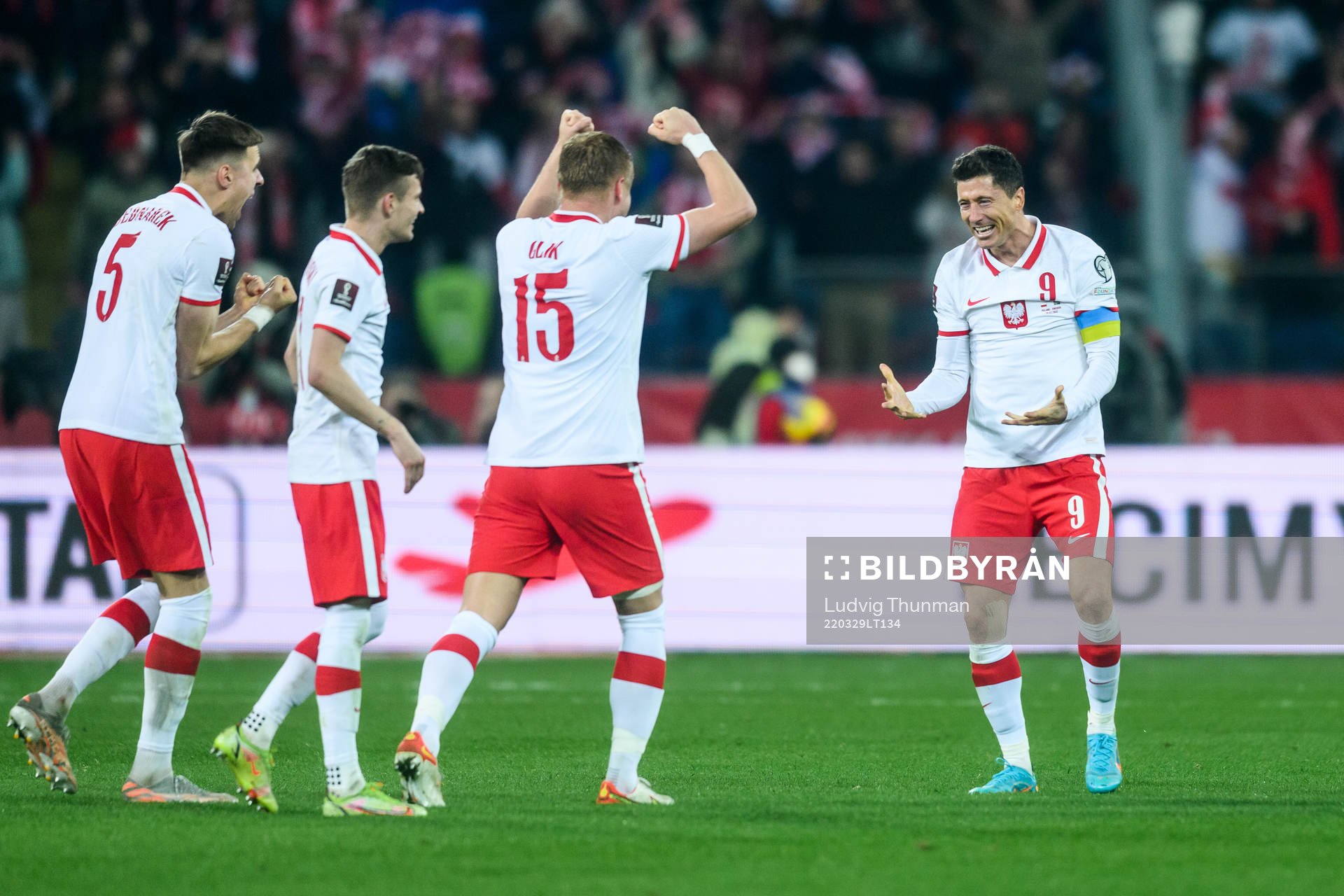 Kamil Glik and Robert Lewandowski of Poland celebrate after the FIFA World Cup Qualifier play-off final between Poland and Sweden on March 29, 2022 in Katowice.