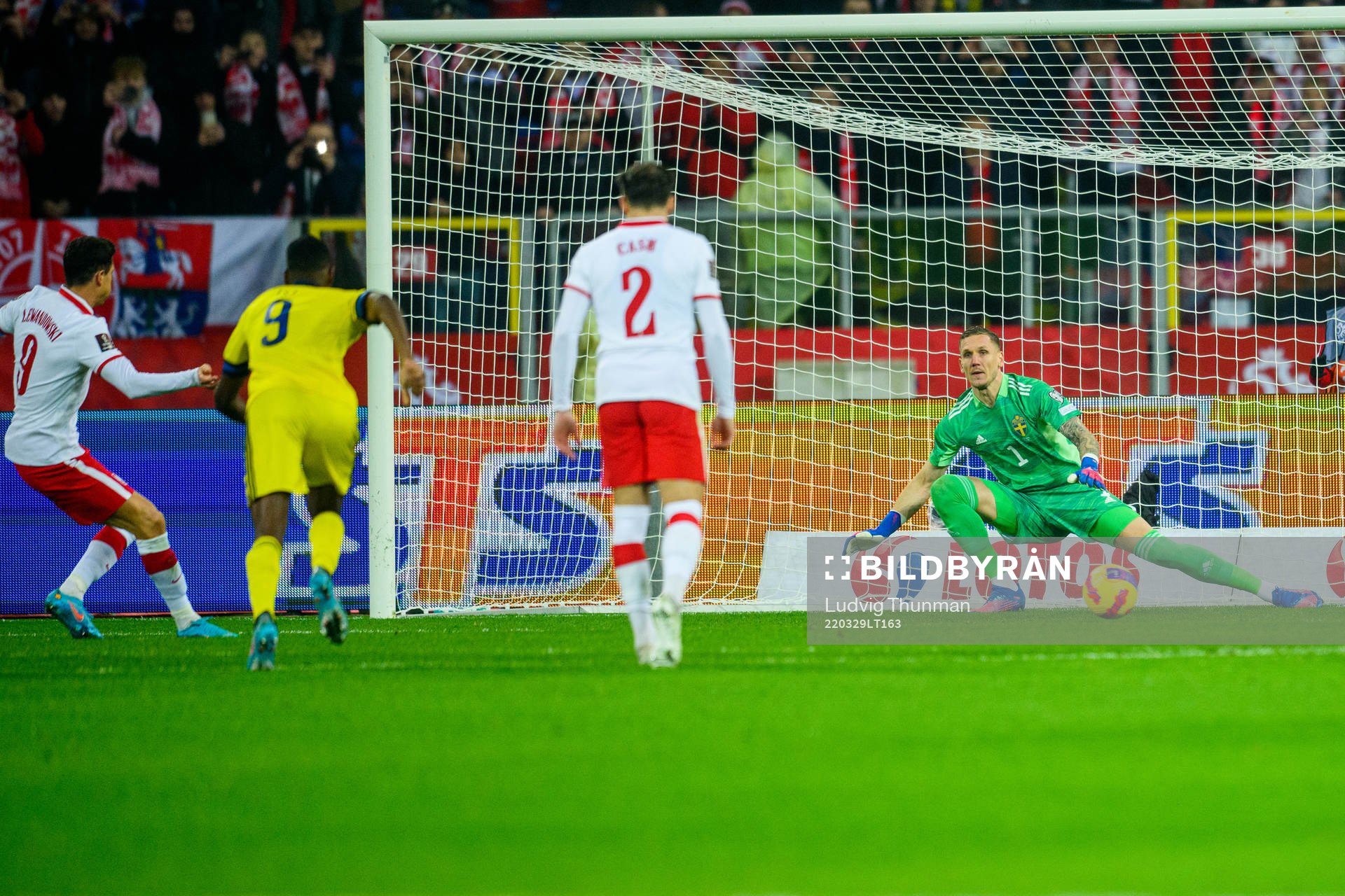 Robert Lewandowski of Poland scores 1-0