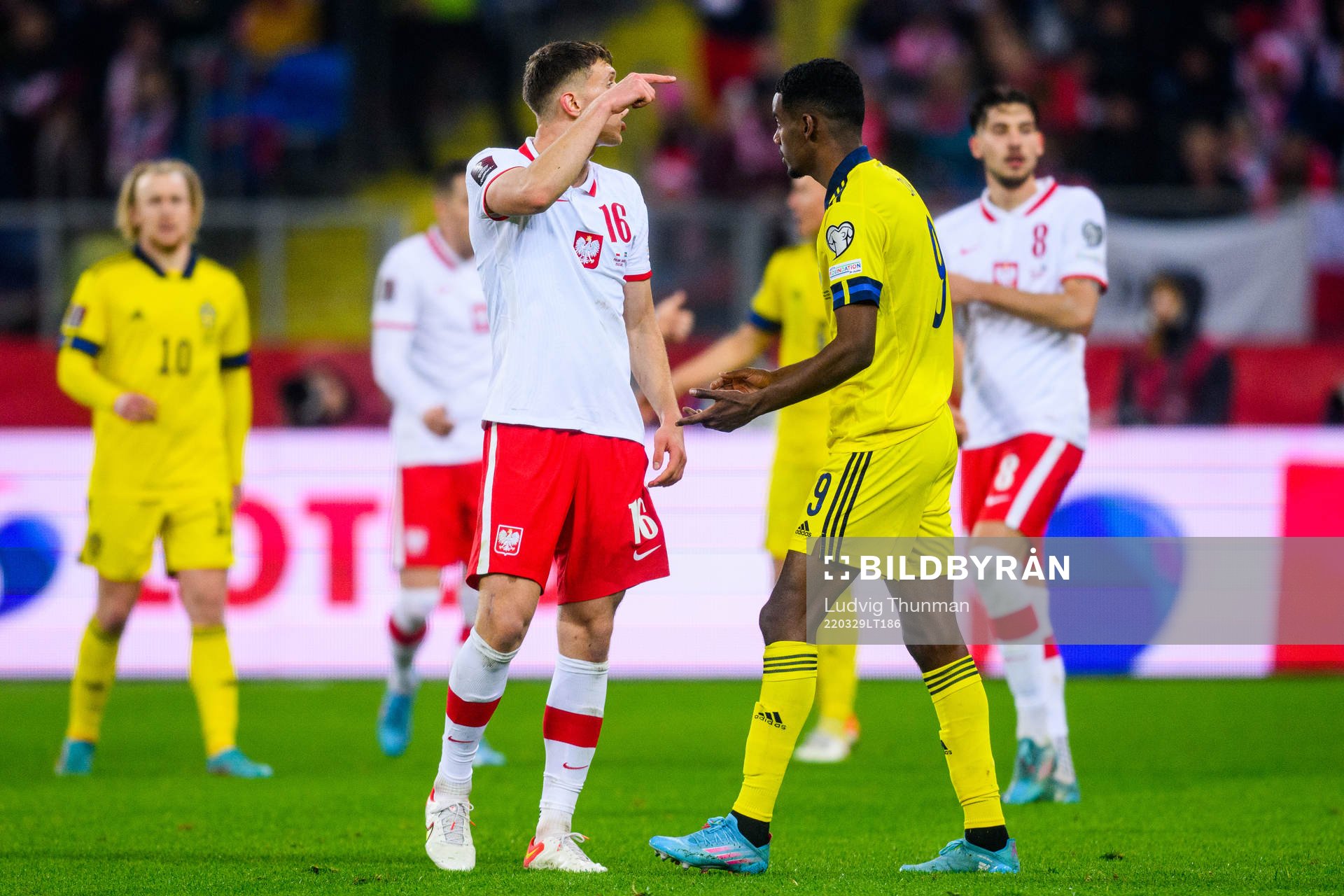 Krystian Bielik of Poland and Alexander Isak of Sweden