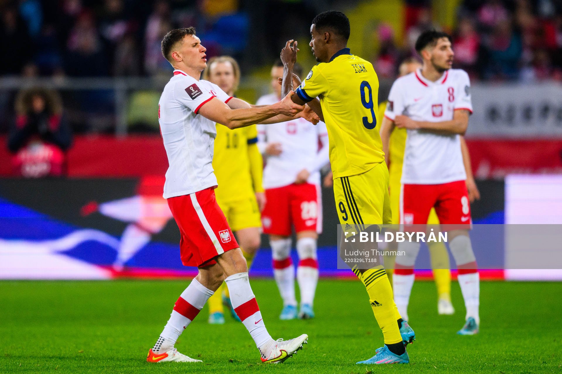 Krystian Bielik of Poland and Alexander Isak of Sweden