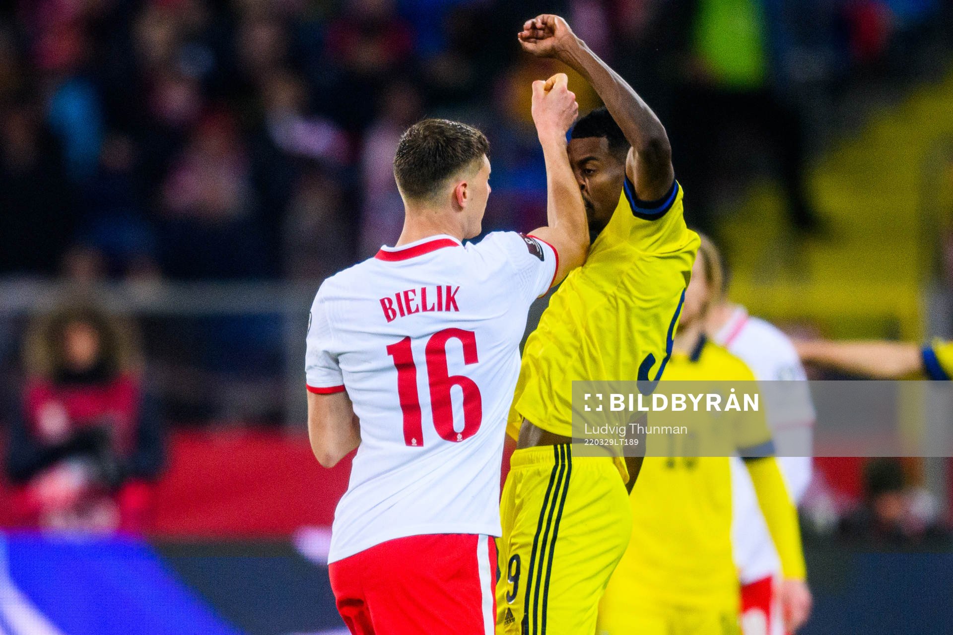 Krystian Bielik of Poland and Alexander Isak of Sweden